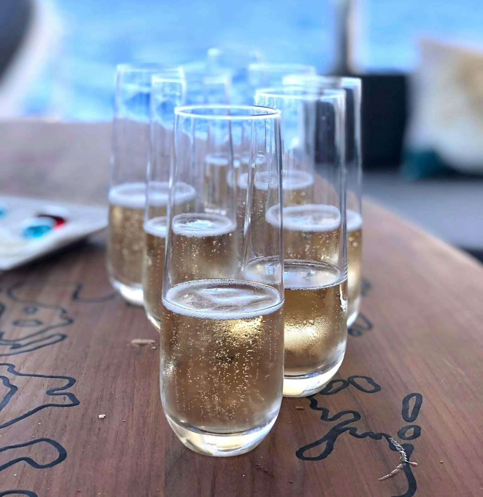 a group of glasses with liquid in them aboard WEIHAII Yacht for Charter