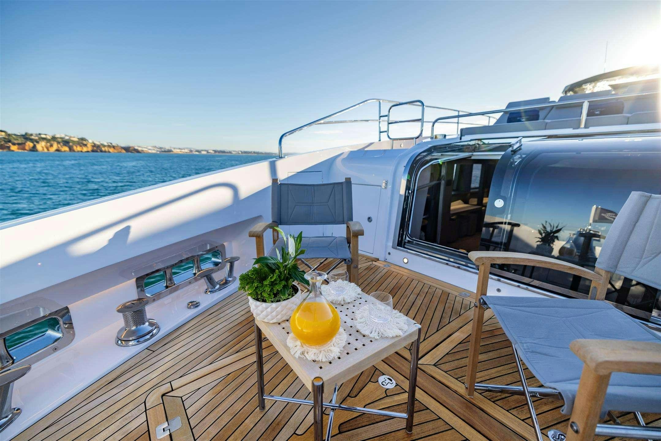 a boat with a lemon on the deck aboard MY SCORPION Yacht for Charter
