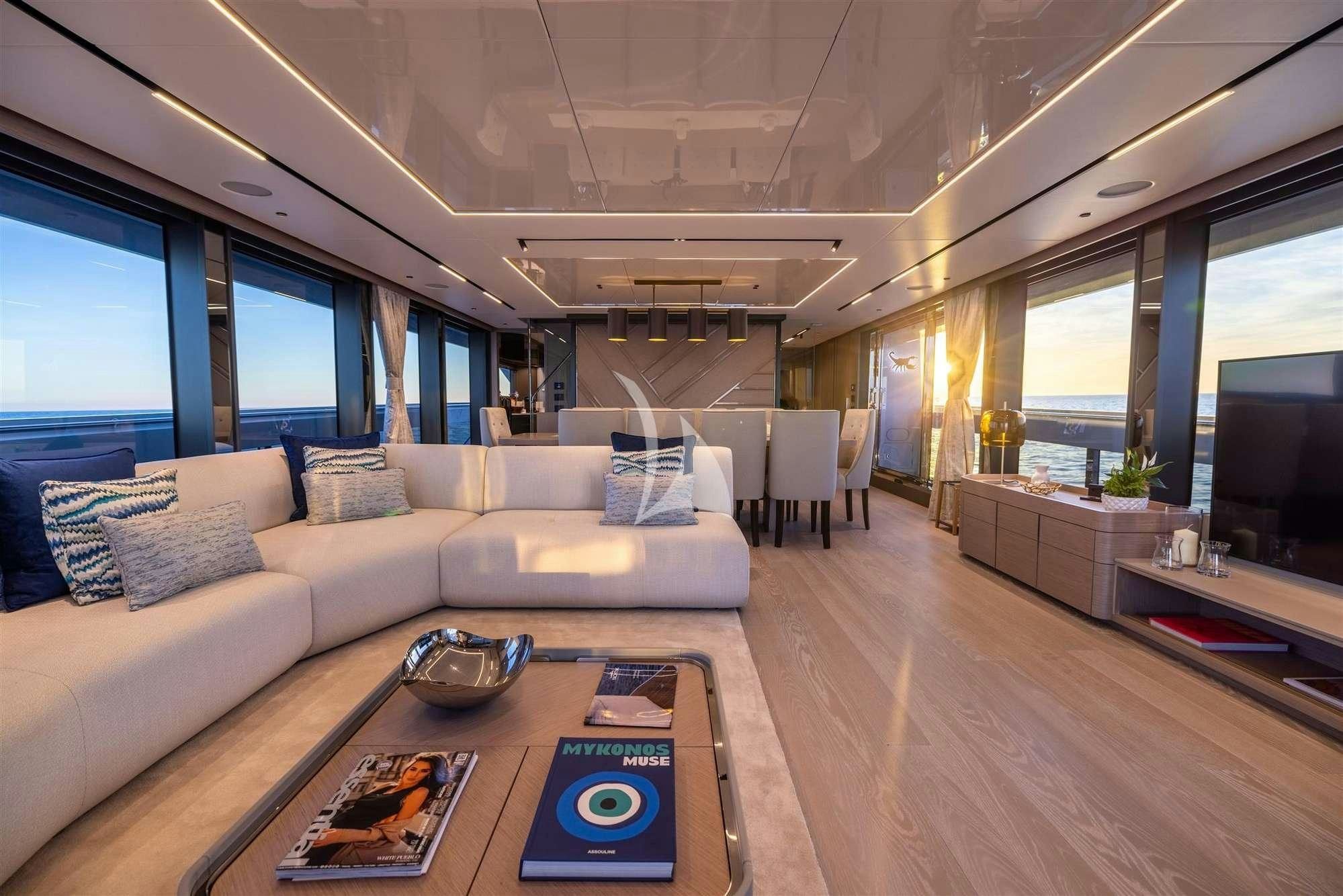 a living room with a large sofa aboard MY SCORPION Yacht for Charter