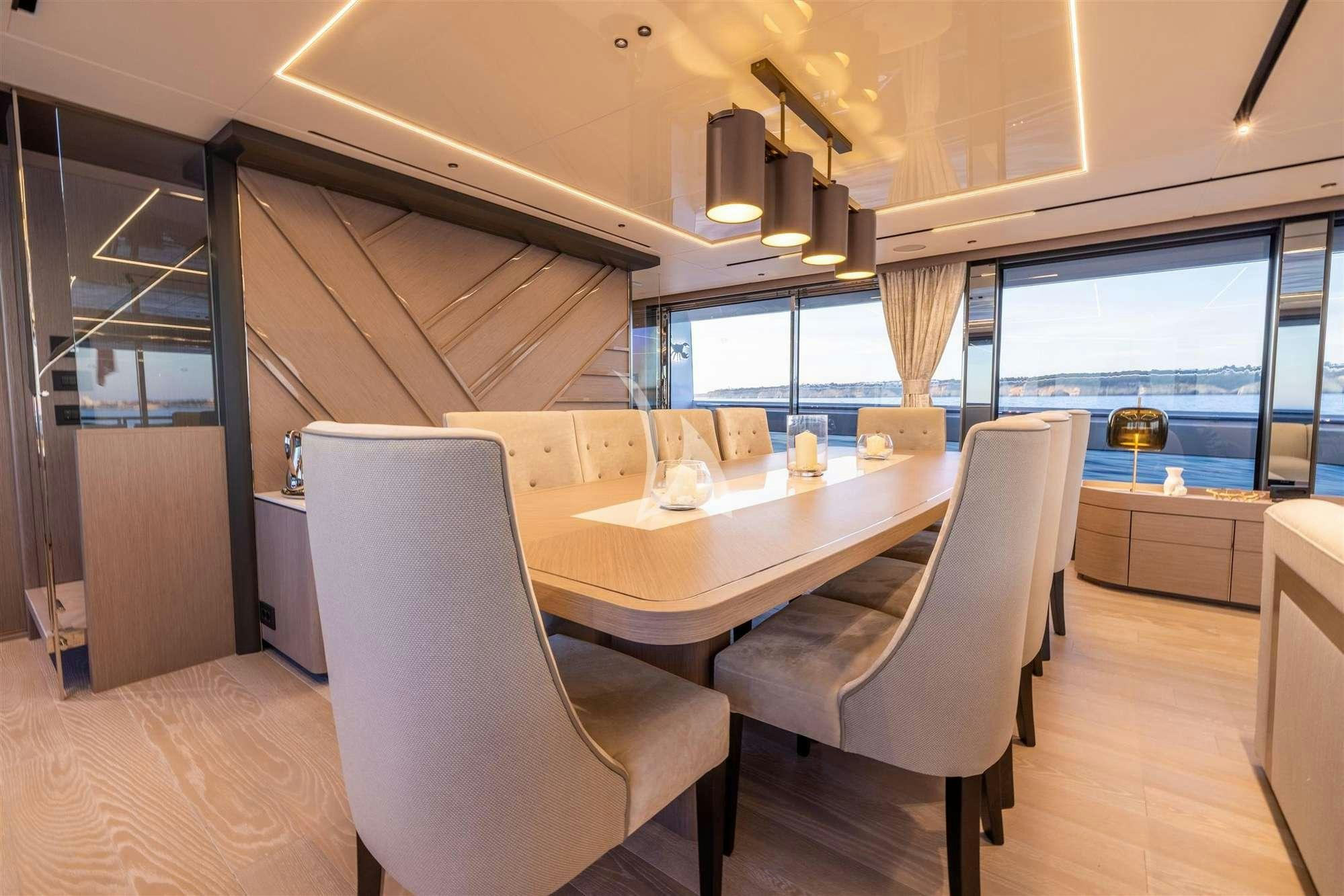 a room with a table and chairs aboard MY SCORPION Yacht for Charter