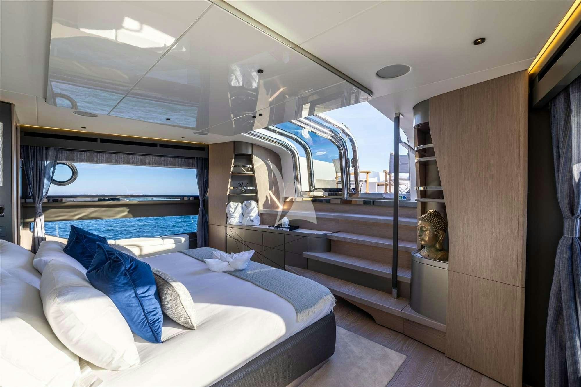 a room with a bed and a mirror aboard MY SCORPION Yacht for Charter