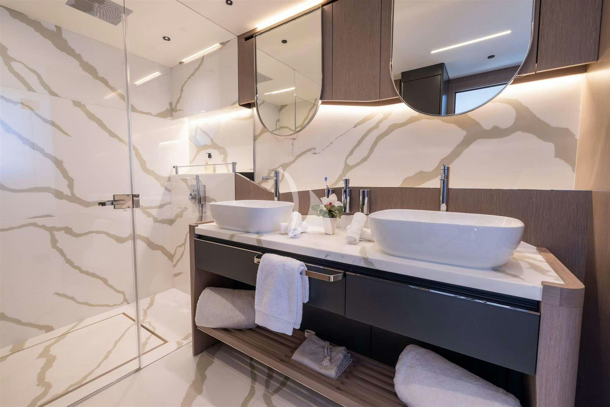 a bathroom with a sink and a shower aboard MY SCORPION Yacht for Charter