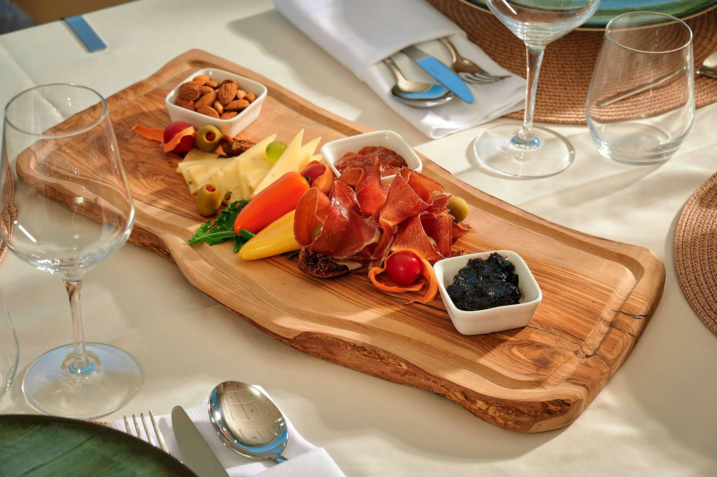 a cutting board with food on it aboard STELLA D'ORO Yacht for Charter
