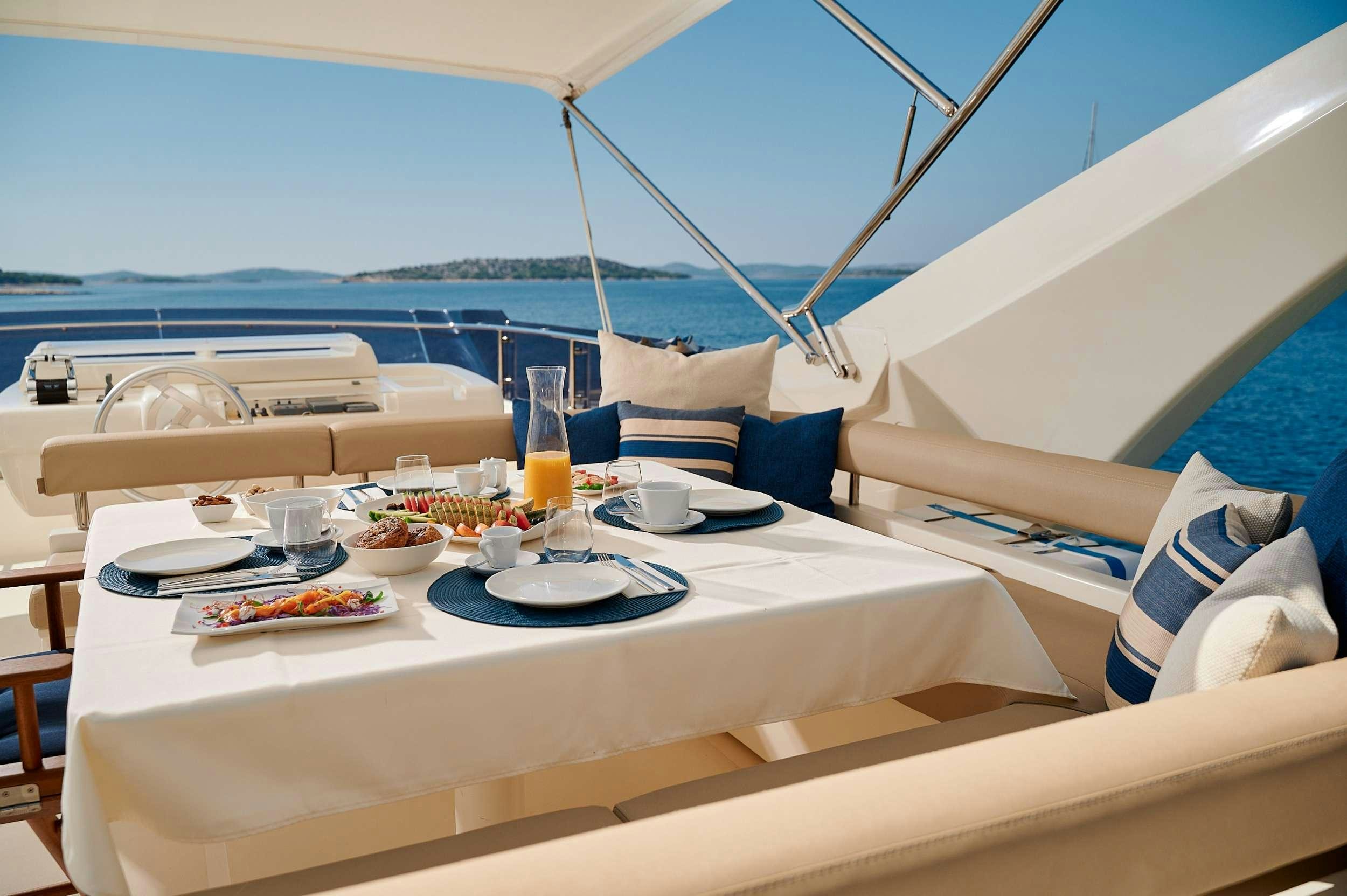 a table with food on it aboard STELLA D'ORO Yacht for Charter