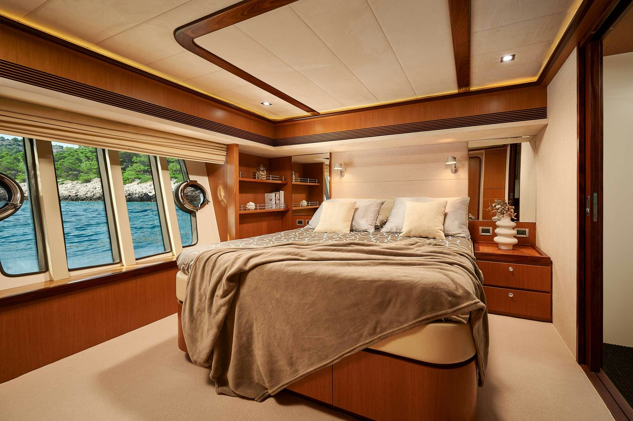 a bed in a room aboard STELLA D'ORO Yacht for Charter