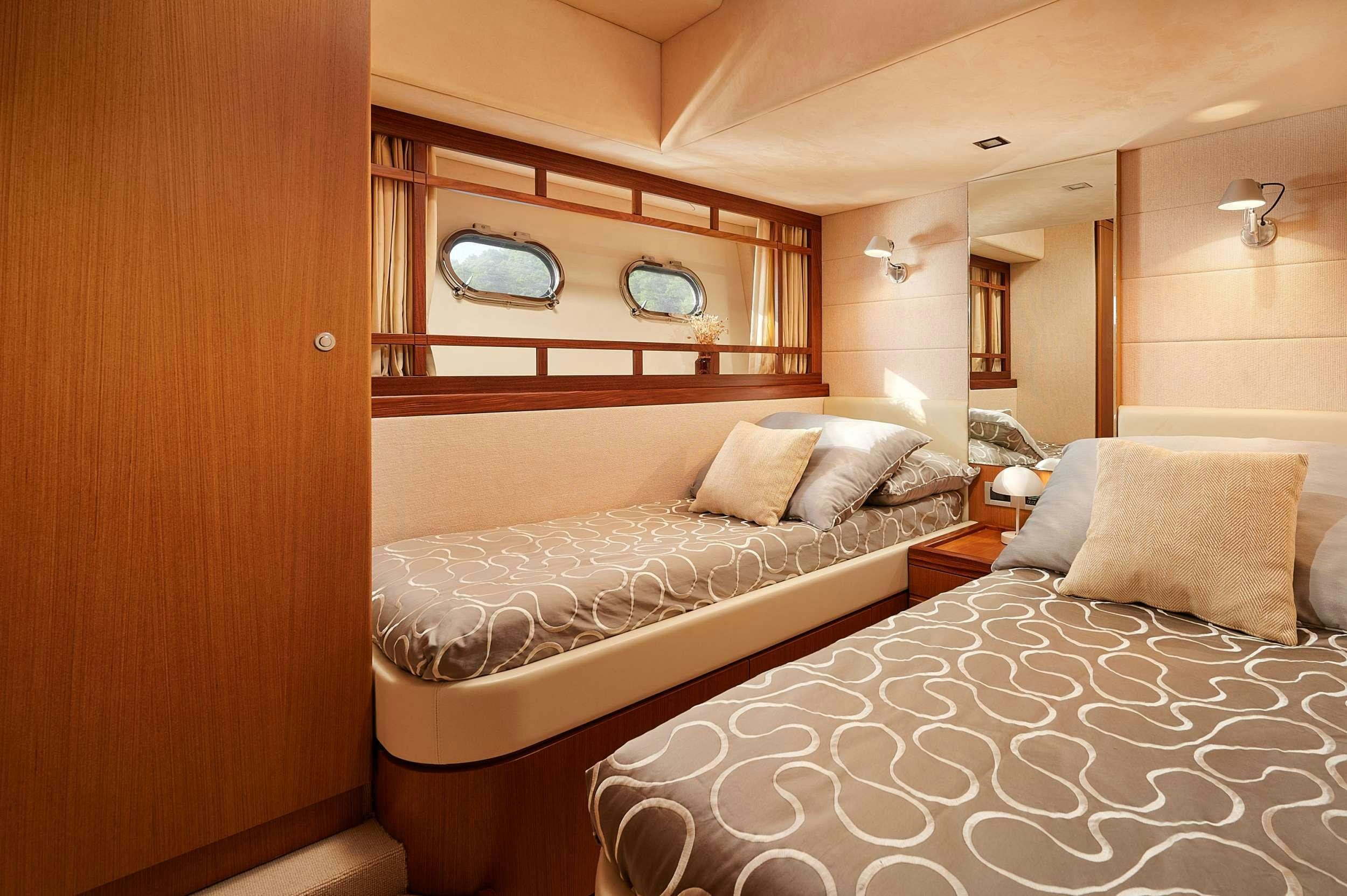 a room with two beds aboard STELLA D'ORO Yacht for Charter