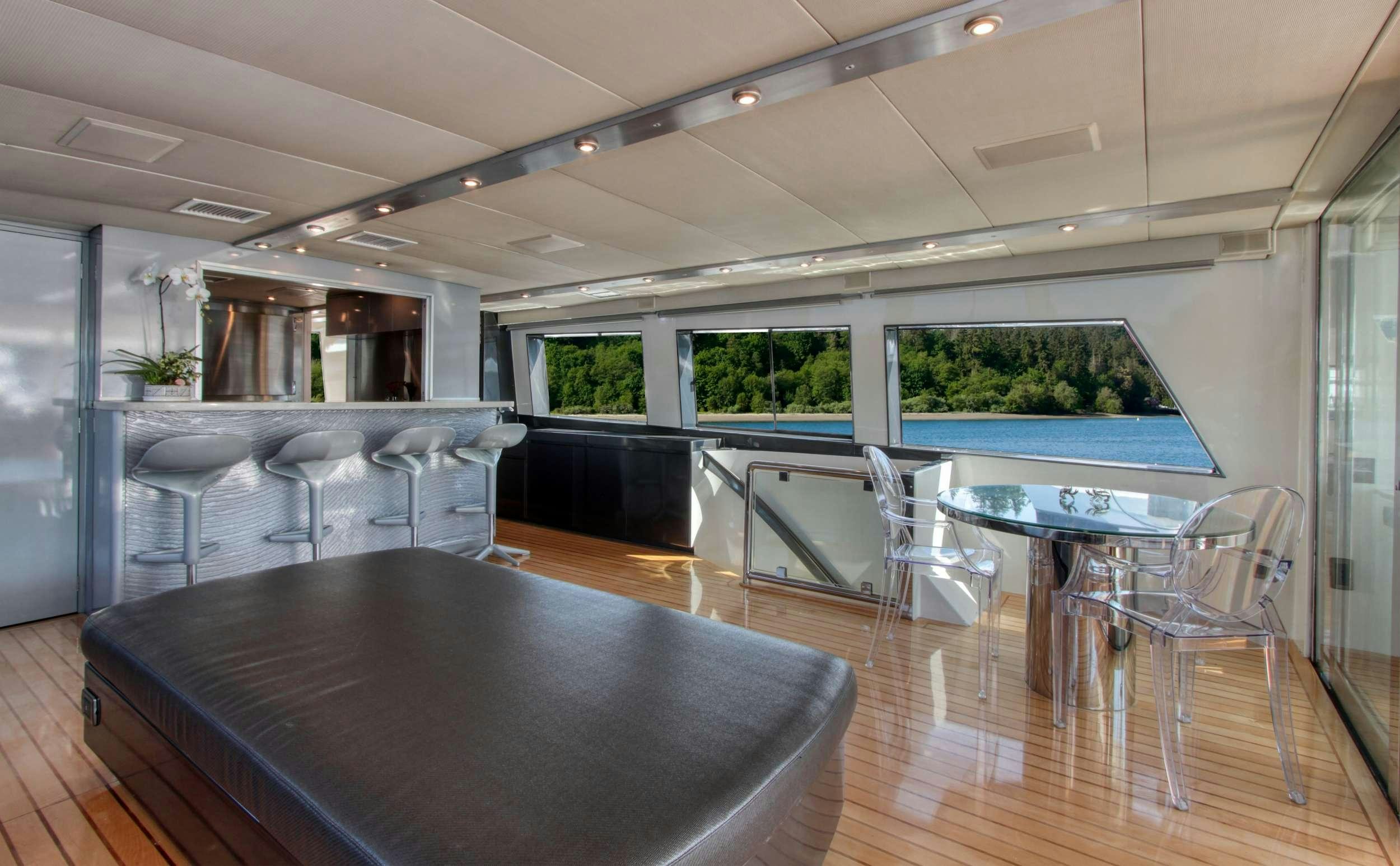 a large kitchen with a large island aboard FIRST HOME Yacht for Charter