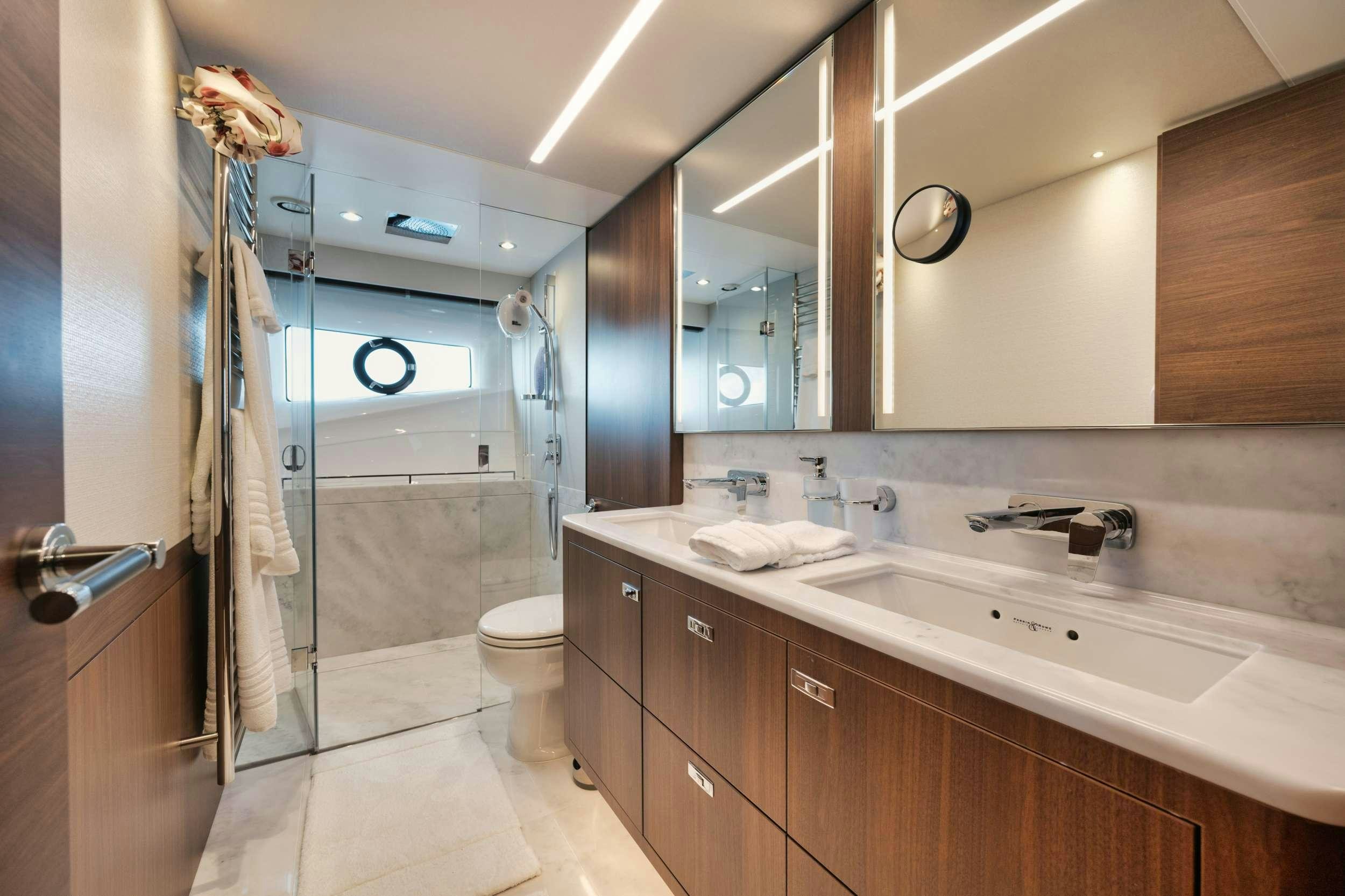 a bathroom with a sink and a toilet aboard HOOKED HER Yacht for Charter