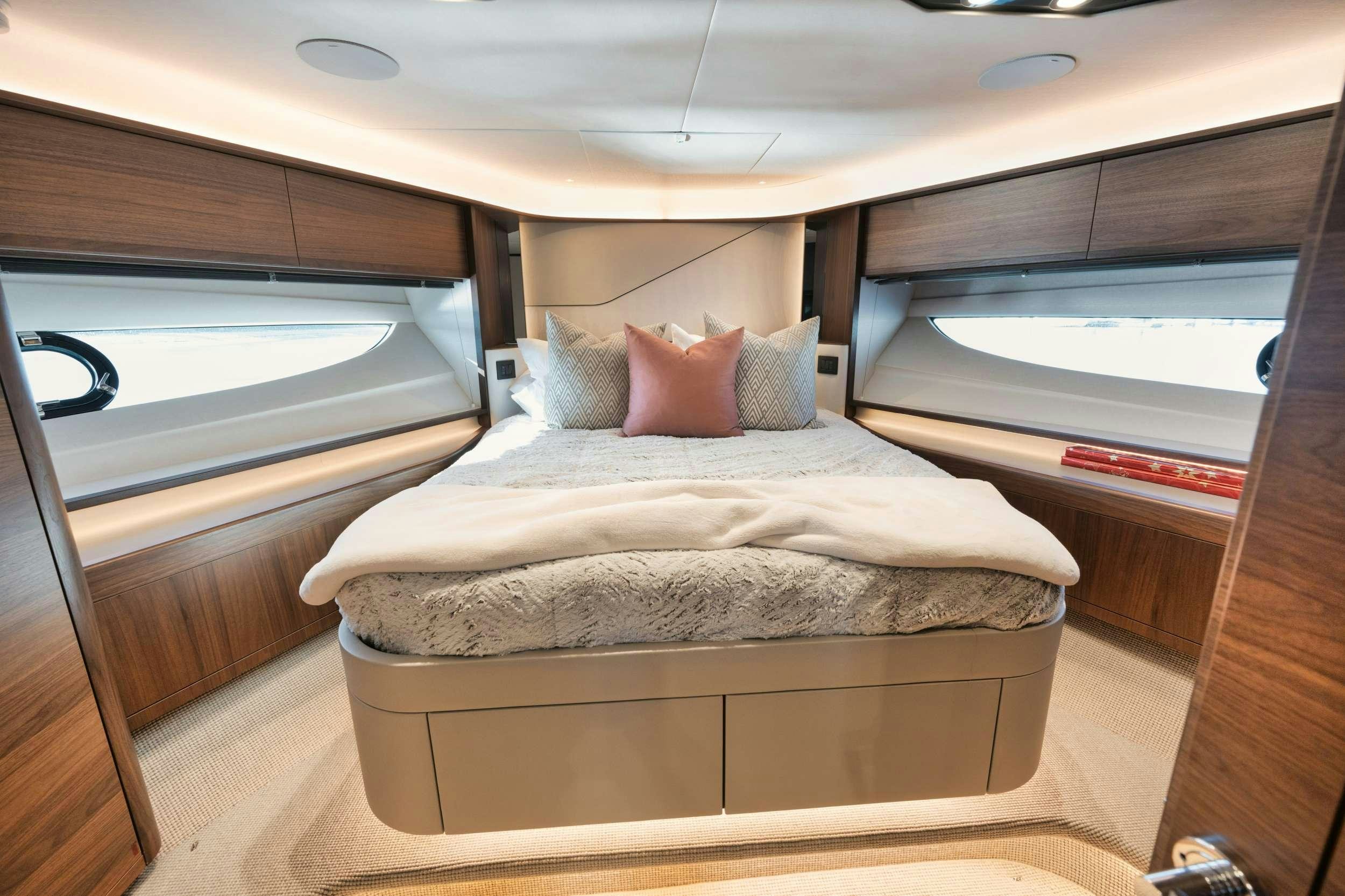 a bed in a cabin aboard HOOKED HER Yacht for Charter