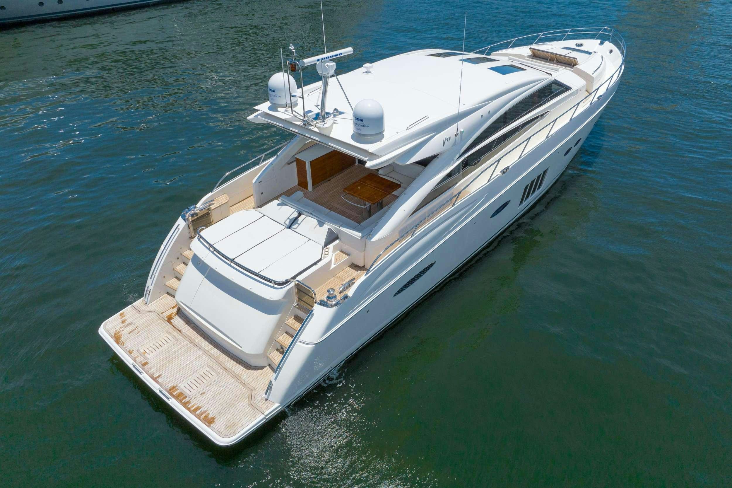 a white boat on the water aboard POLICY LIMITS Yacht for Charter