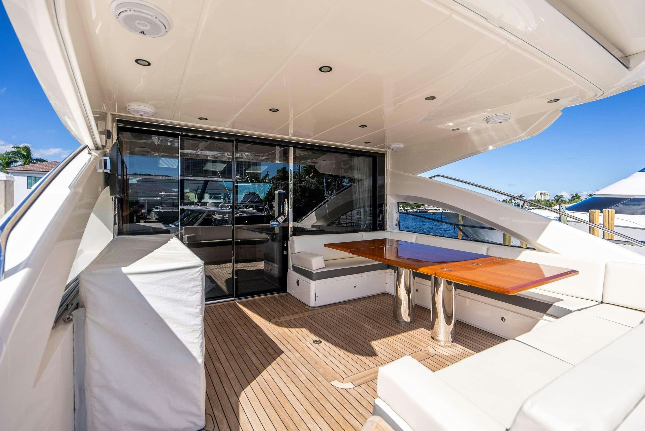 a room with a pool and a deck aboard POLICY LIMITS Yacht for Charter