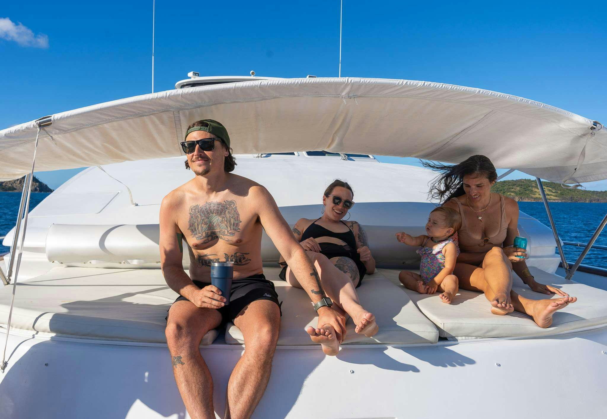 a group of people sitting on a boat aboard STEELING TIME Yacht for Charter