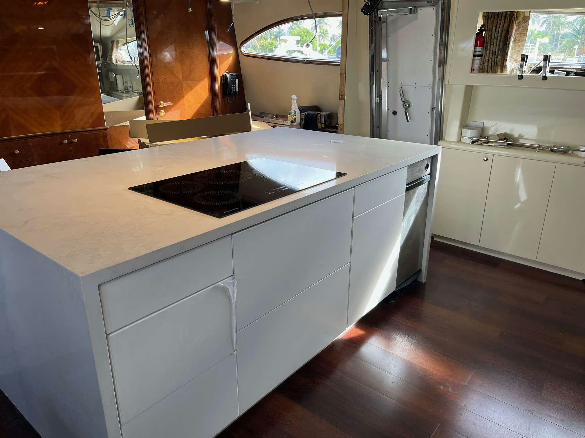 a kitchen with a large island aboard STEELING TIME Yacht for Charter