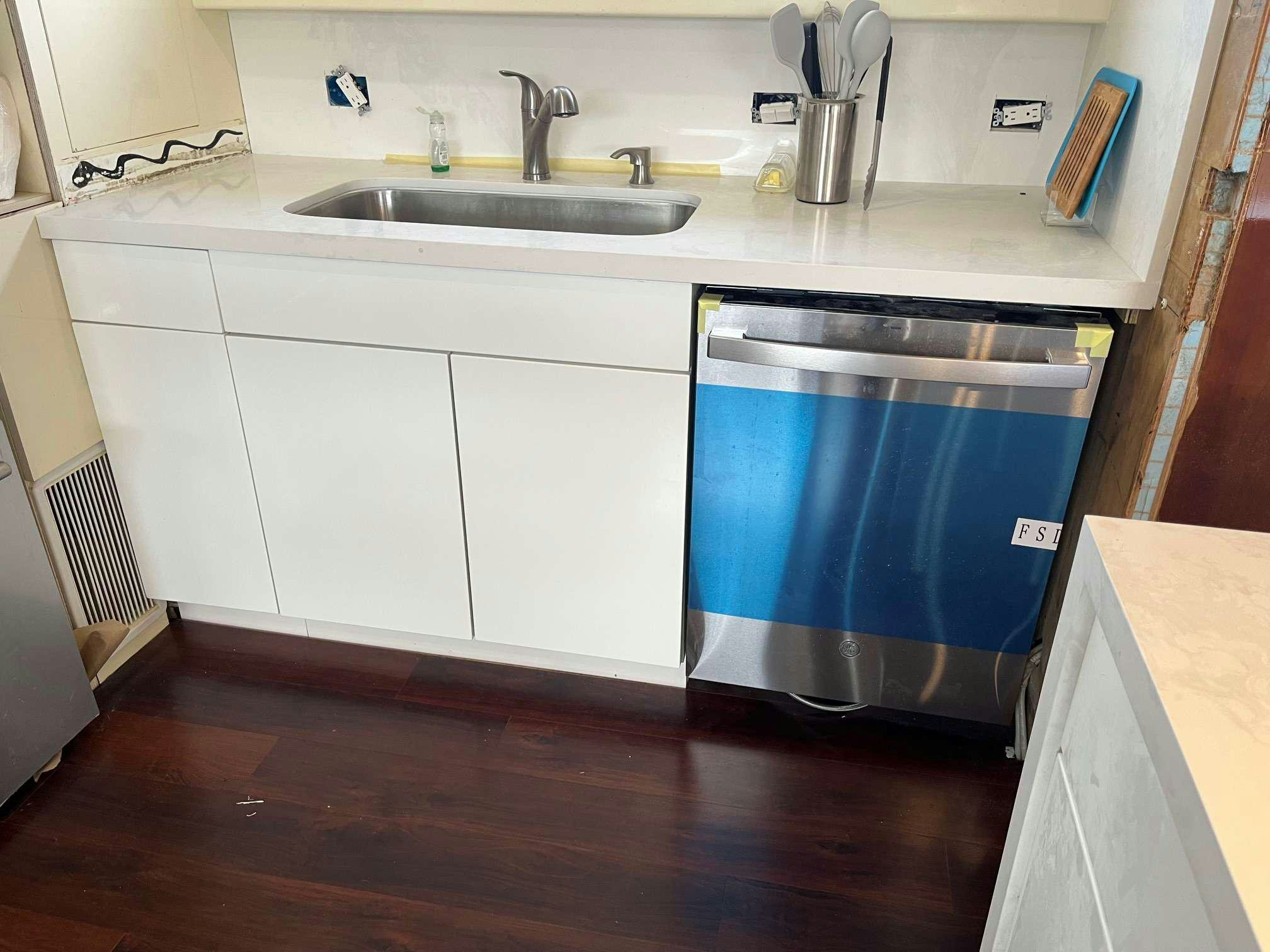 a kitchen with a blue refrigerator aboard STEELING TIME Yacht for Charter