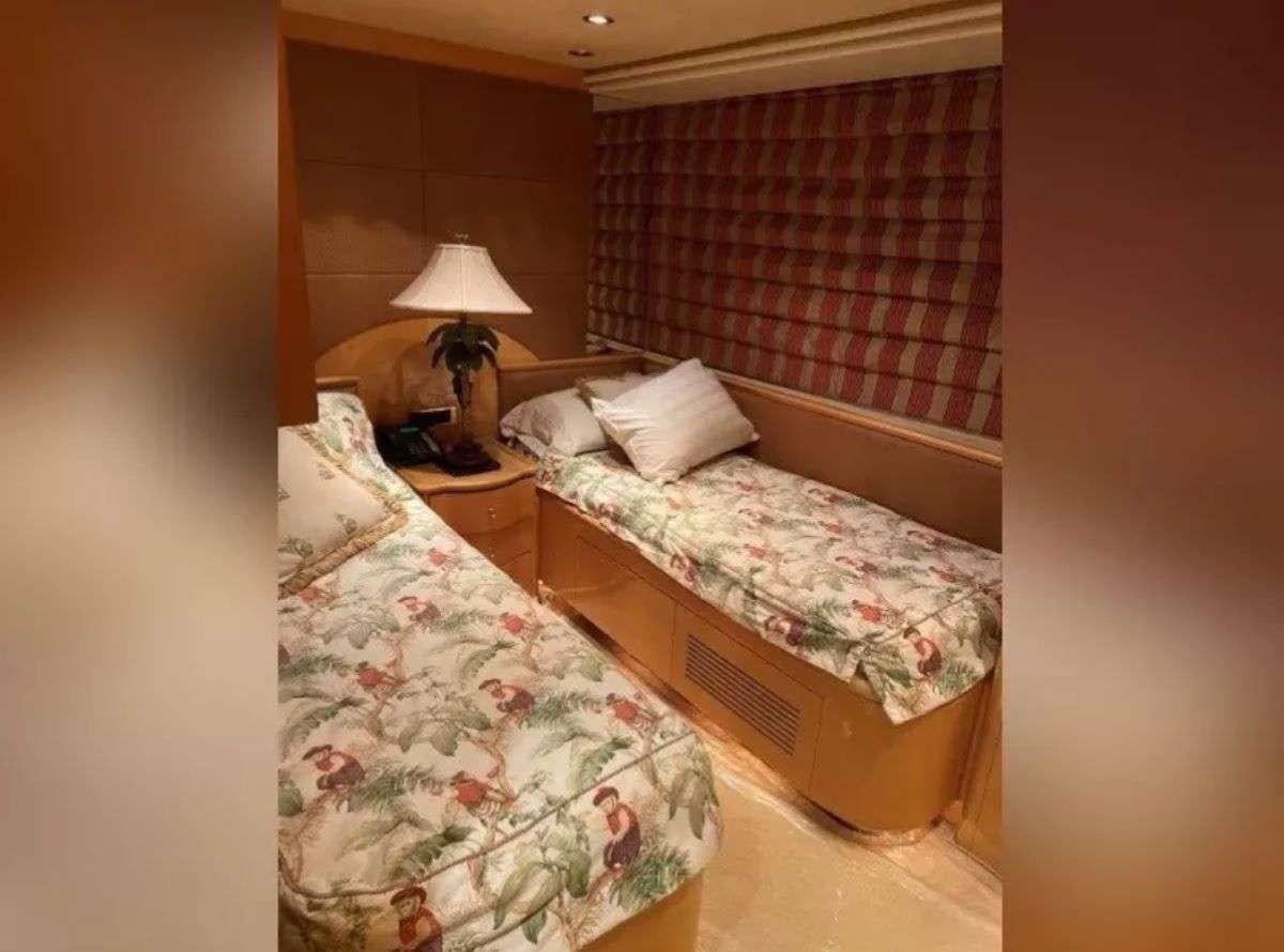 a couple of beds in a hotel room aboard STEELING TIME Yacht for Charter