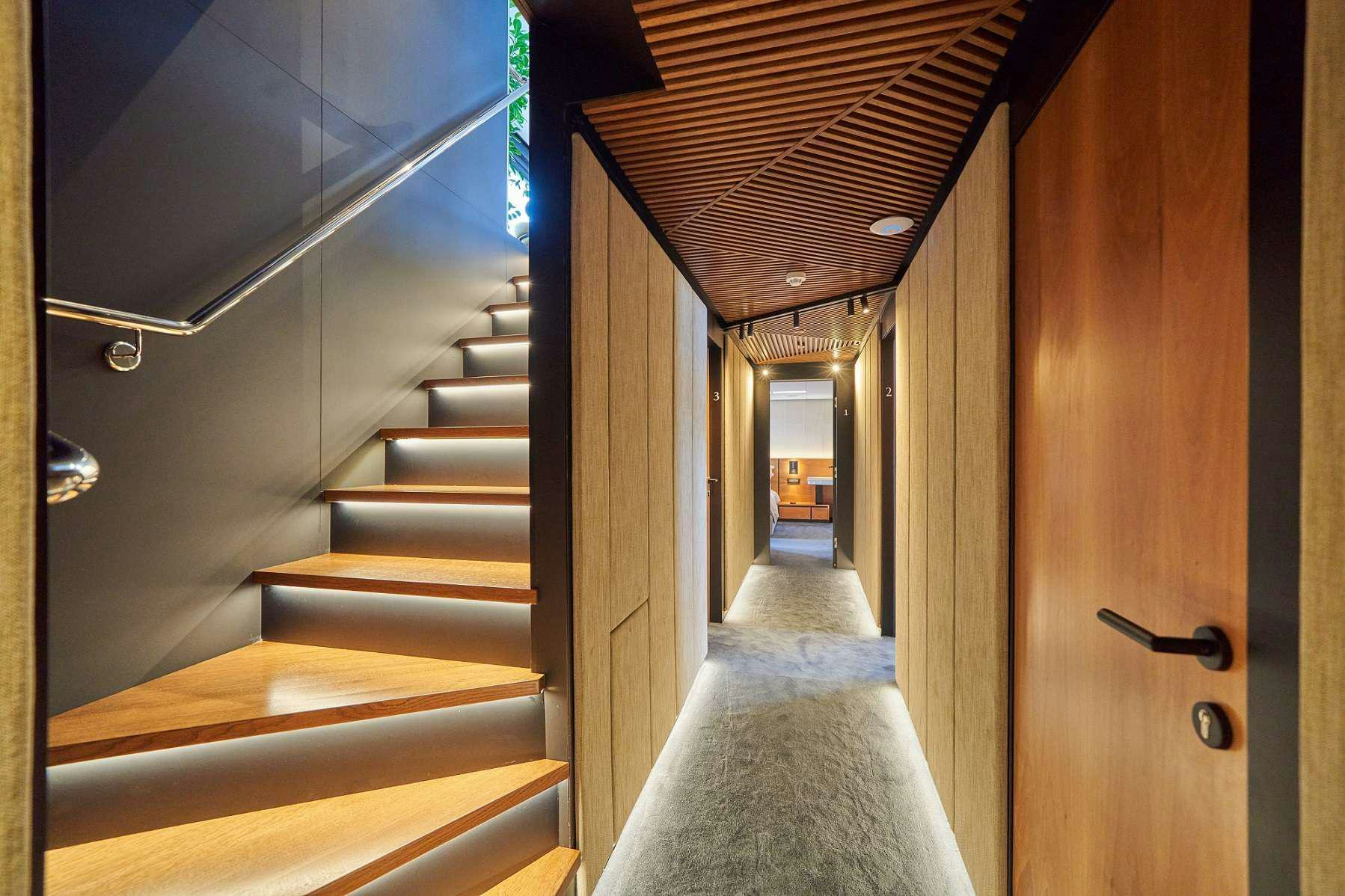 a hallway with a white carpet aboard MARALLURE Yacht for Charter