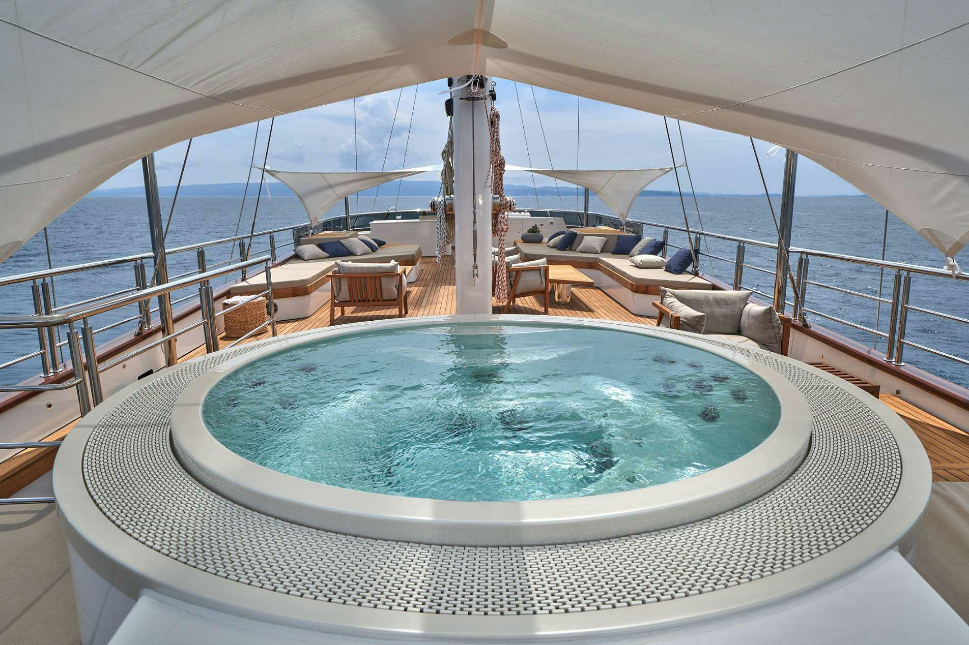 a large swimming pool on a deck aboard MARALLURE Yacht for Charter