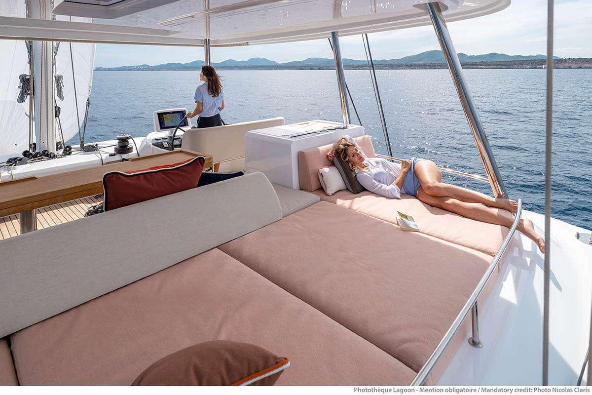 a person lying on a boat aboard VALINOR Yacht for Charter