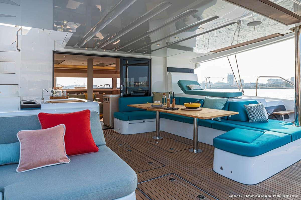 a room with a table and couches aboard VALINOR Yacht for Charter