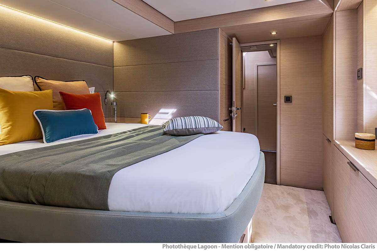 a bed with pillows aboard VALINOR Yacht for Charter