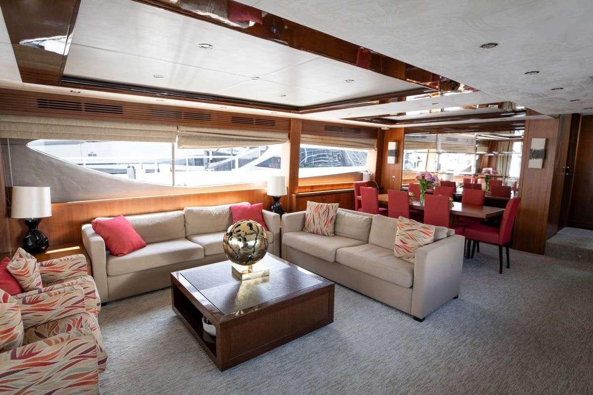 a living room with a large window aboard AG Yacht for Charter
