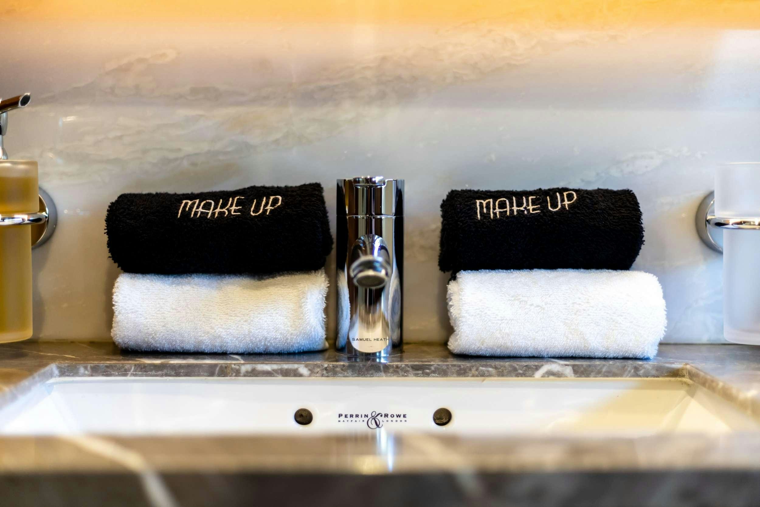 a counter with a towel and a bottle of water aboard VISTA Yacht for Charter