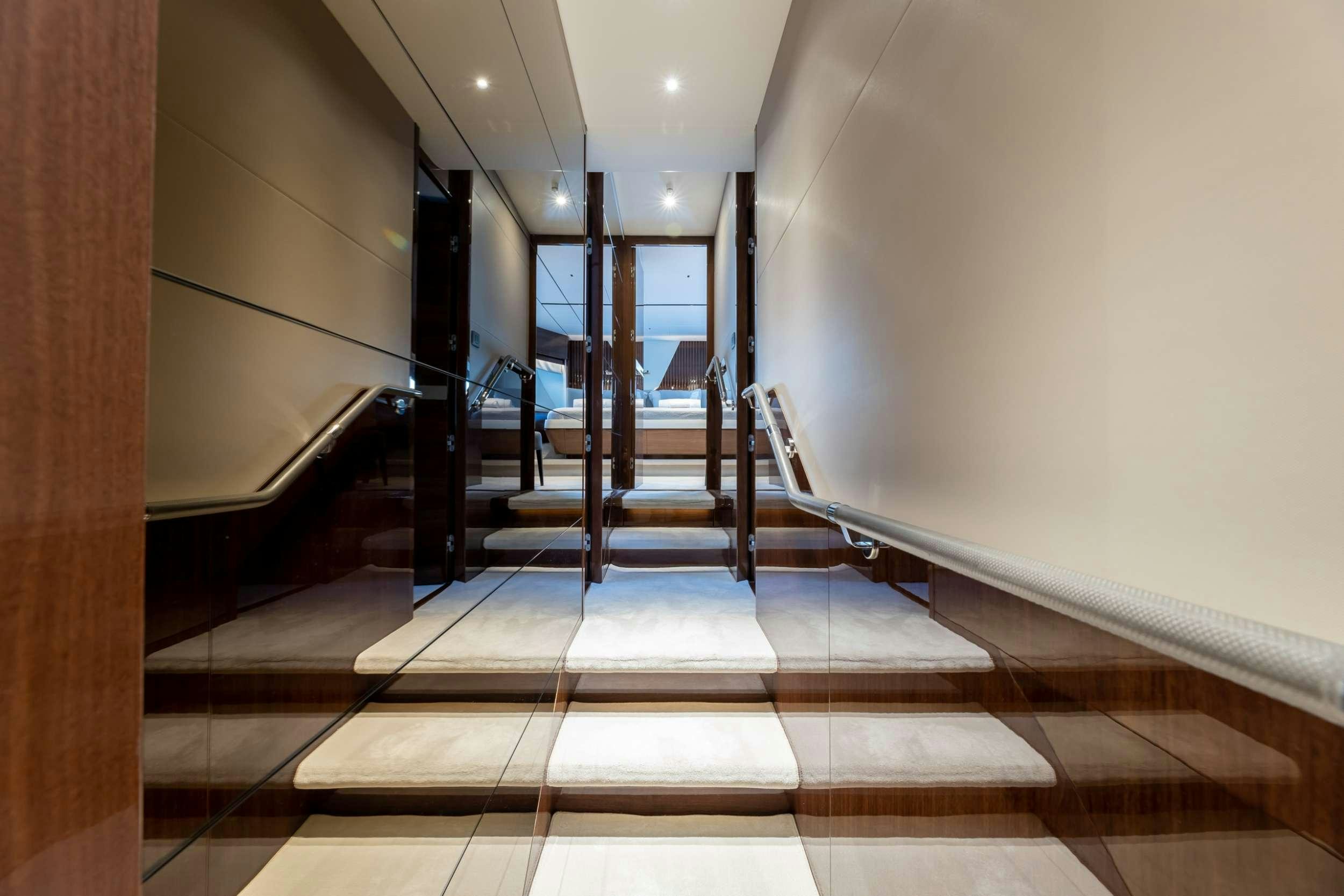 a hallway with a glass door aboard VISTA Yacht for Charter