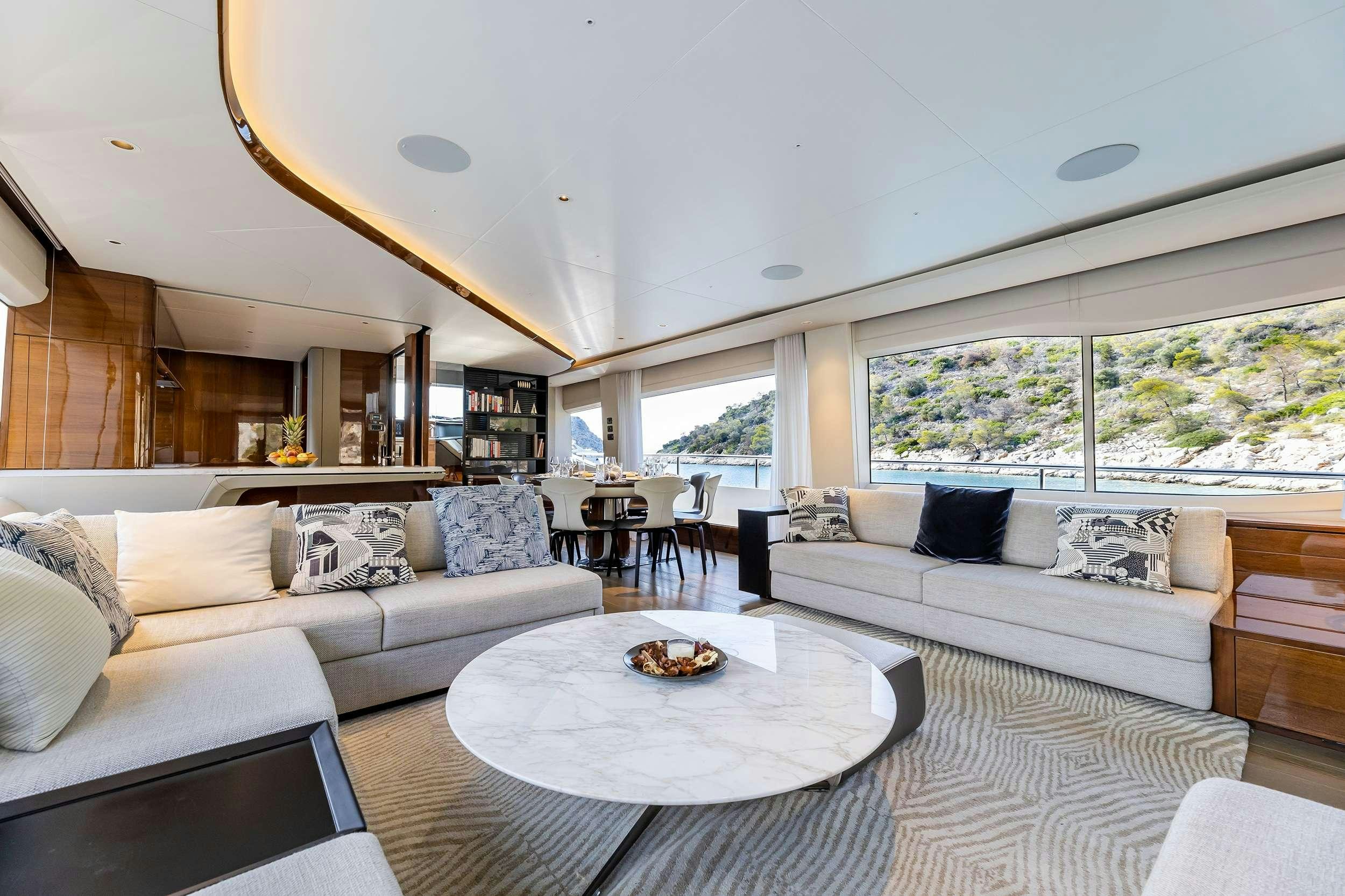 a living room with a couch and a table aboard VISTA Yacht for Charter