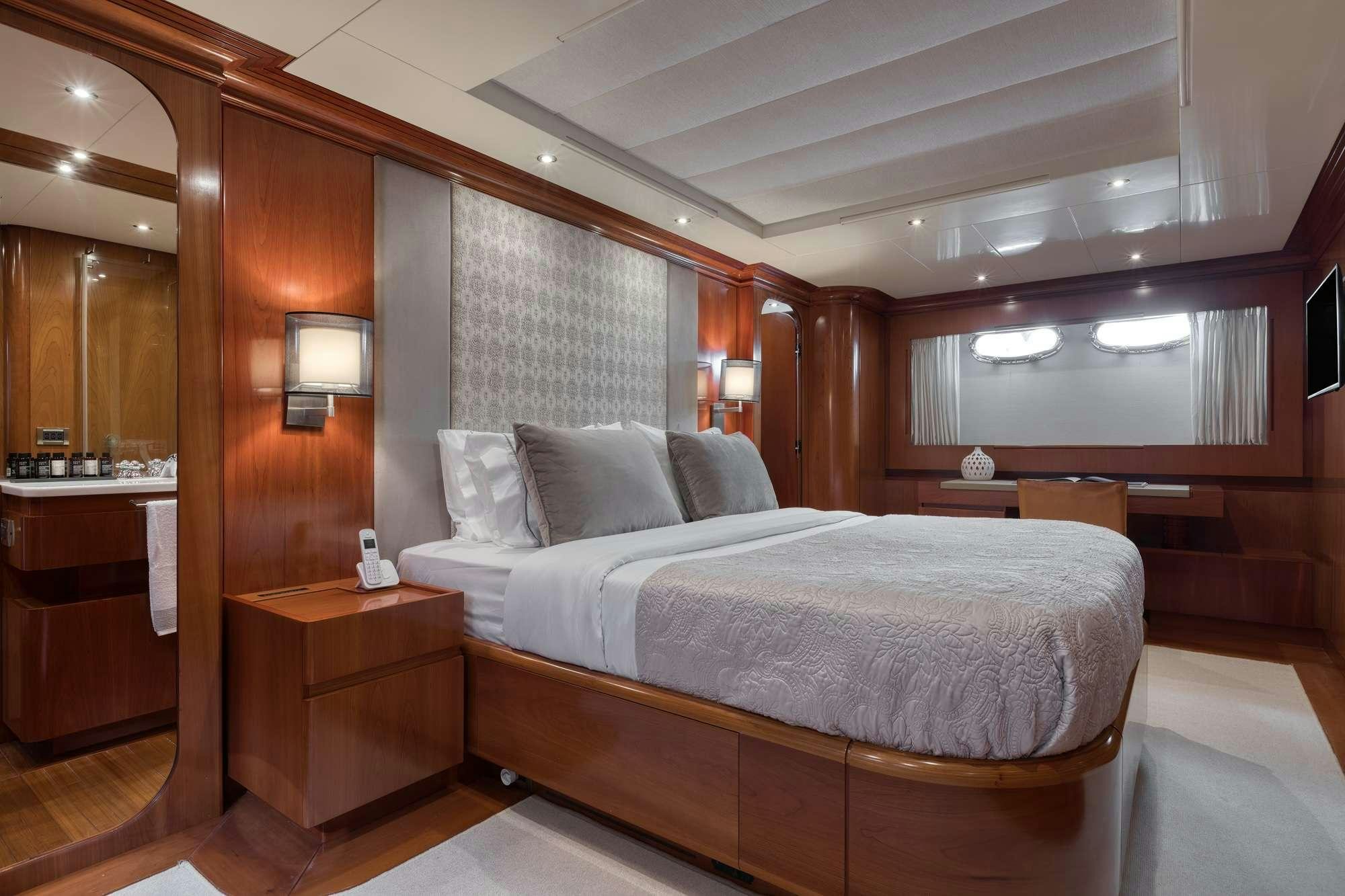 a bed in a room aboard WHY Yacht for Charter