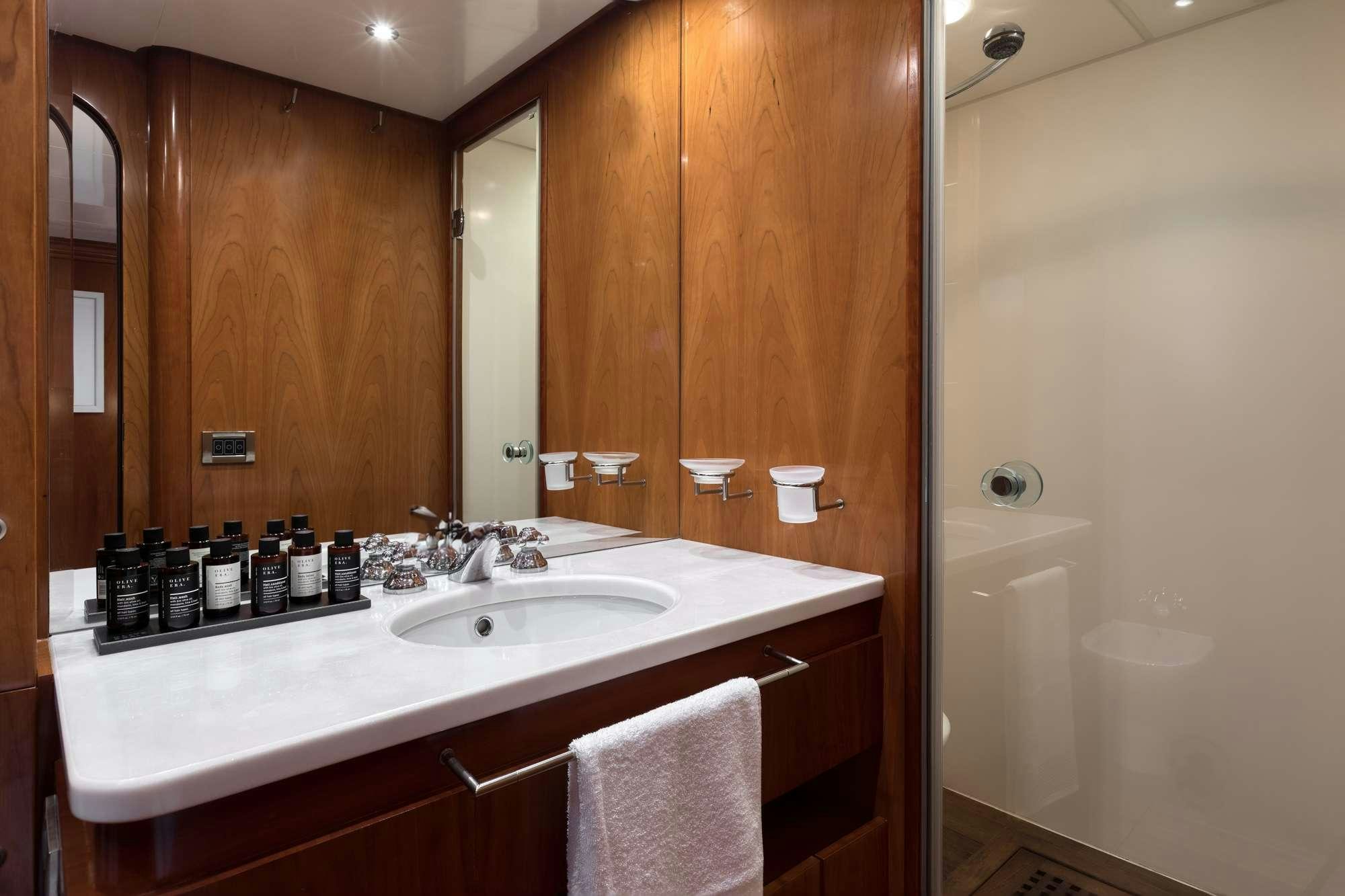 a bathroom with a large mirror aboard WHY Yacht for Charter
