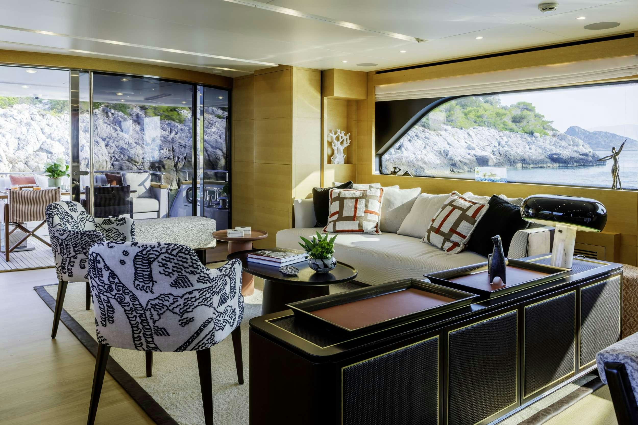 a living room with a large window aboard ELYSIUM Yacht for Charter