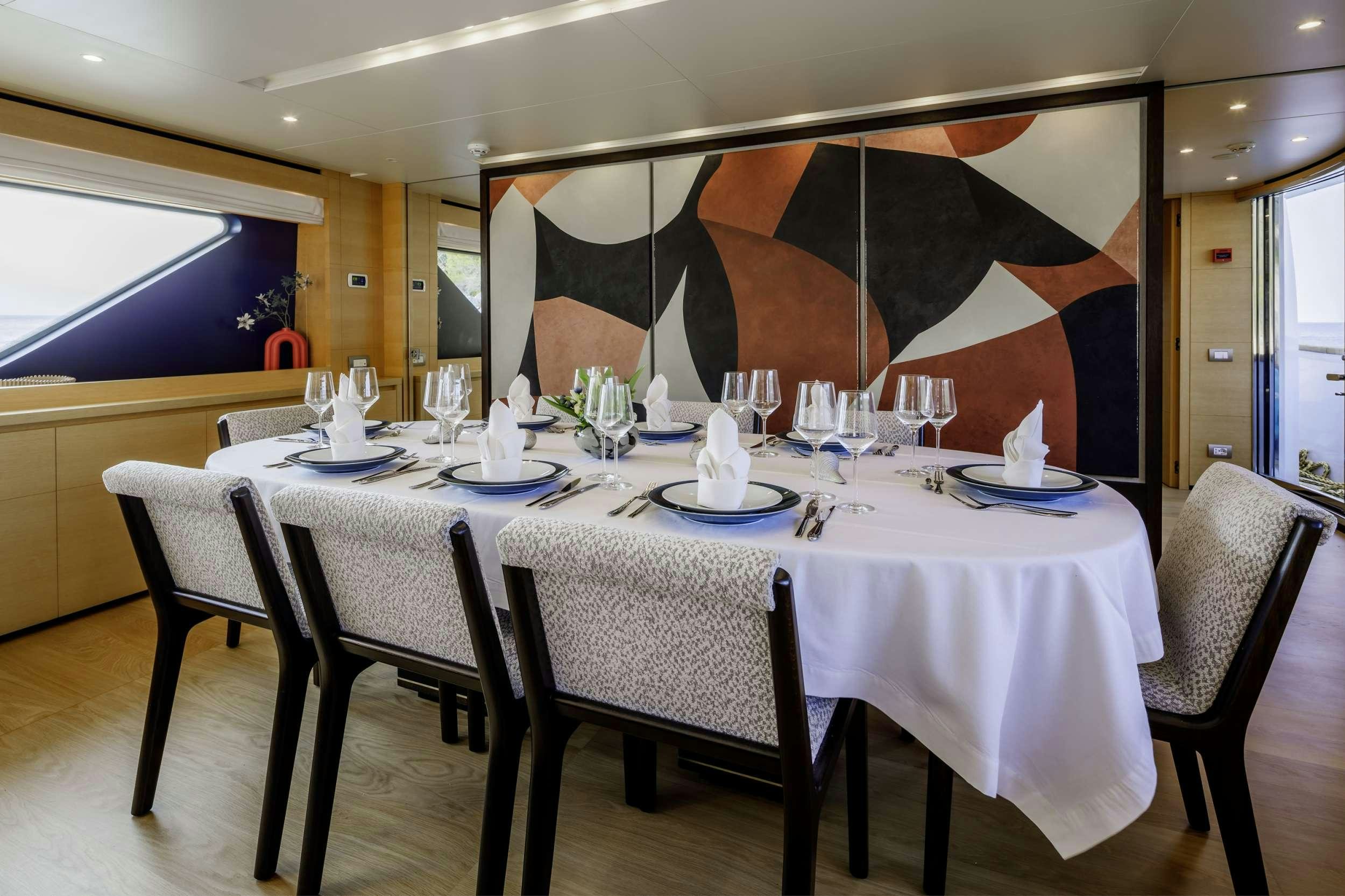 a table set for a dinner aboard ELYSIUM Yacht for Charter