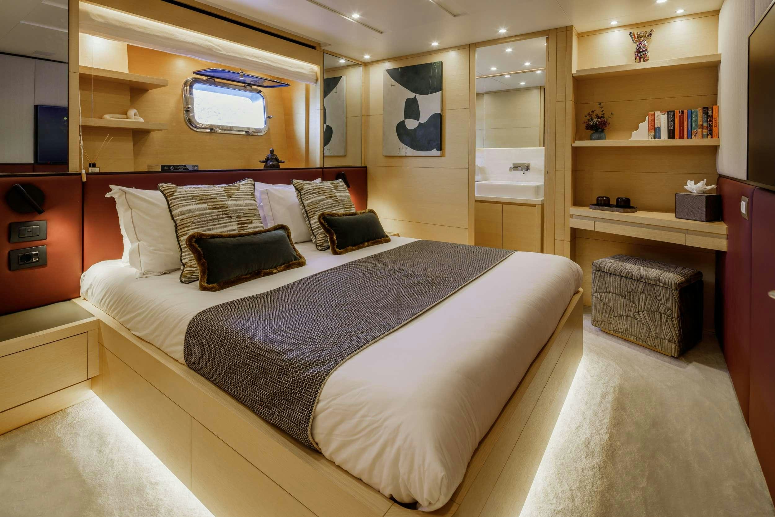 a bed in a room aboard ELYSIUM Yacht for Charter