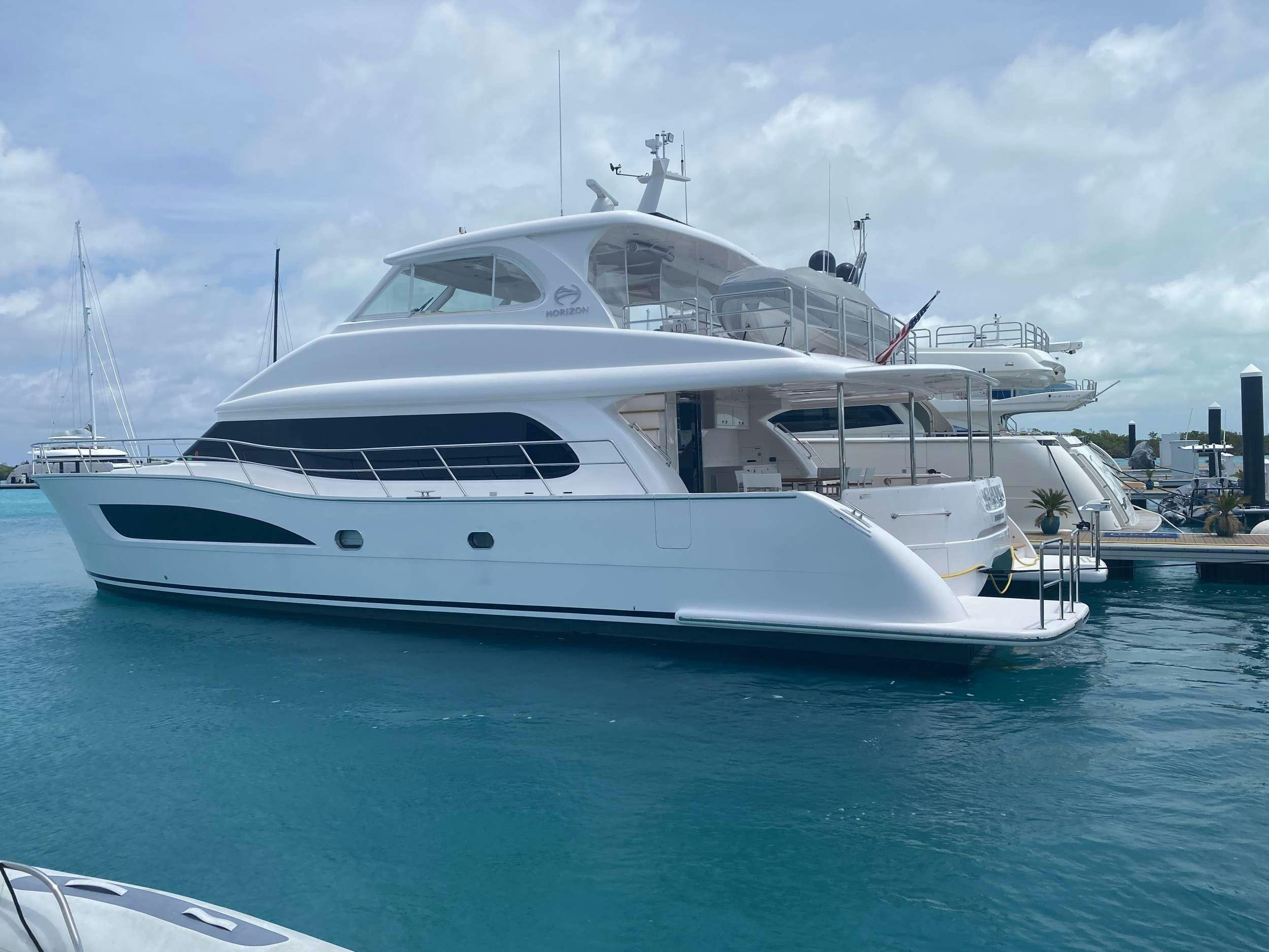 a white yacht in a harbor aboard SALUS Yacht for Charter
