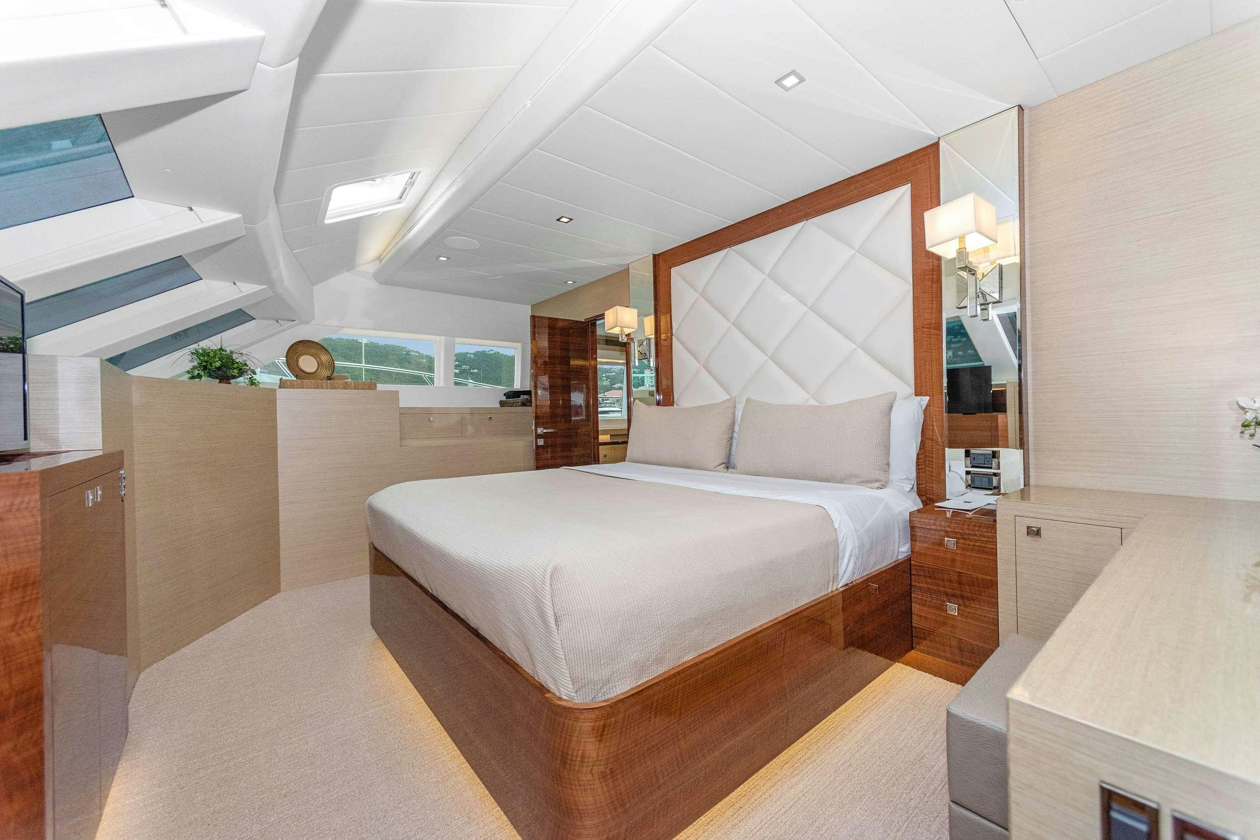 a large bedroom with a large bed aboard SALUS Yacht for Charter