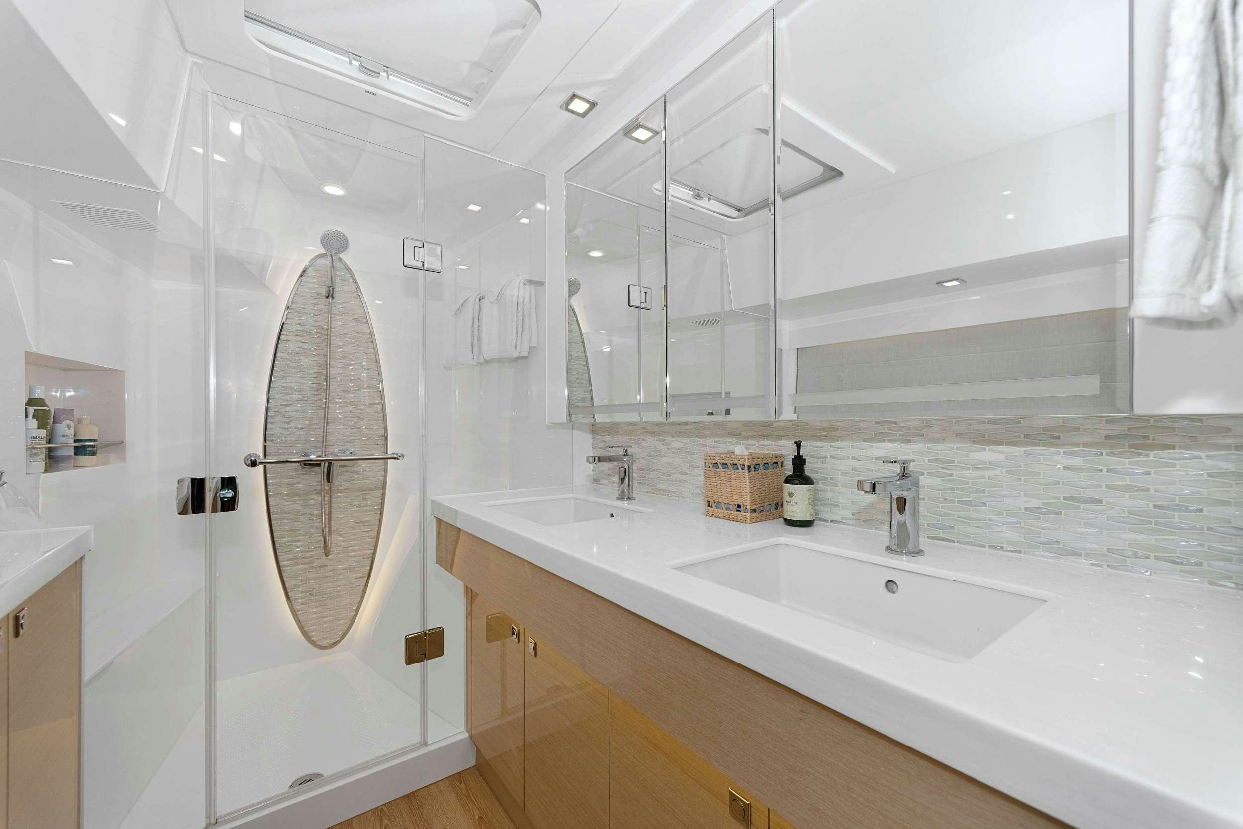 a bathroom with a shower and sink aboard SALUS Yacht for Charter