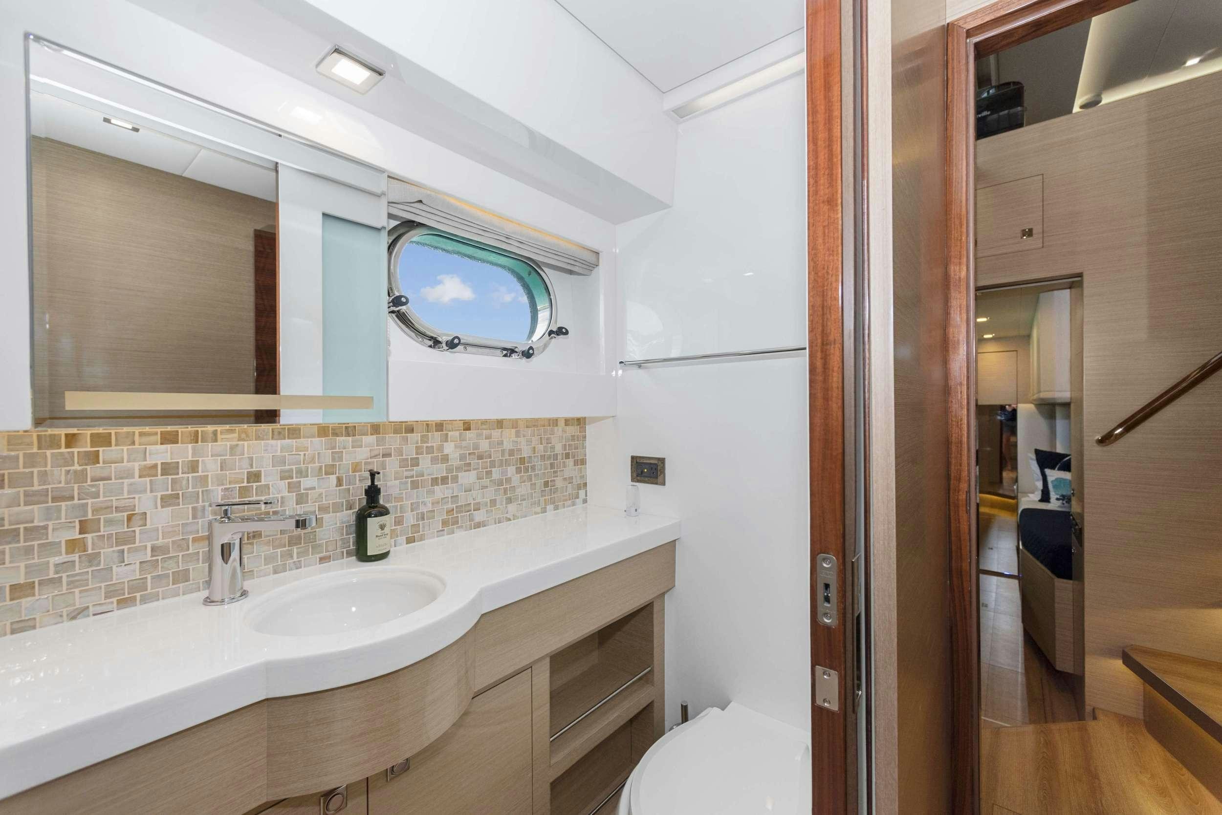 a bathroom with a large mirror aboard SALUS Yacht for Charter