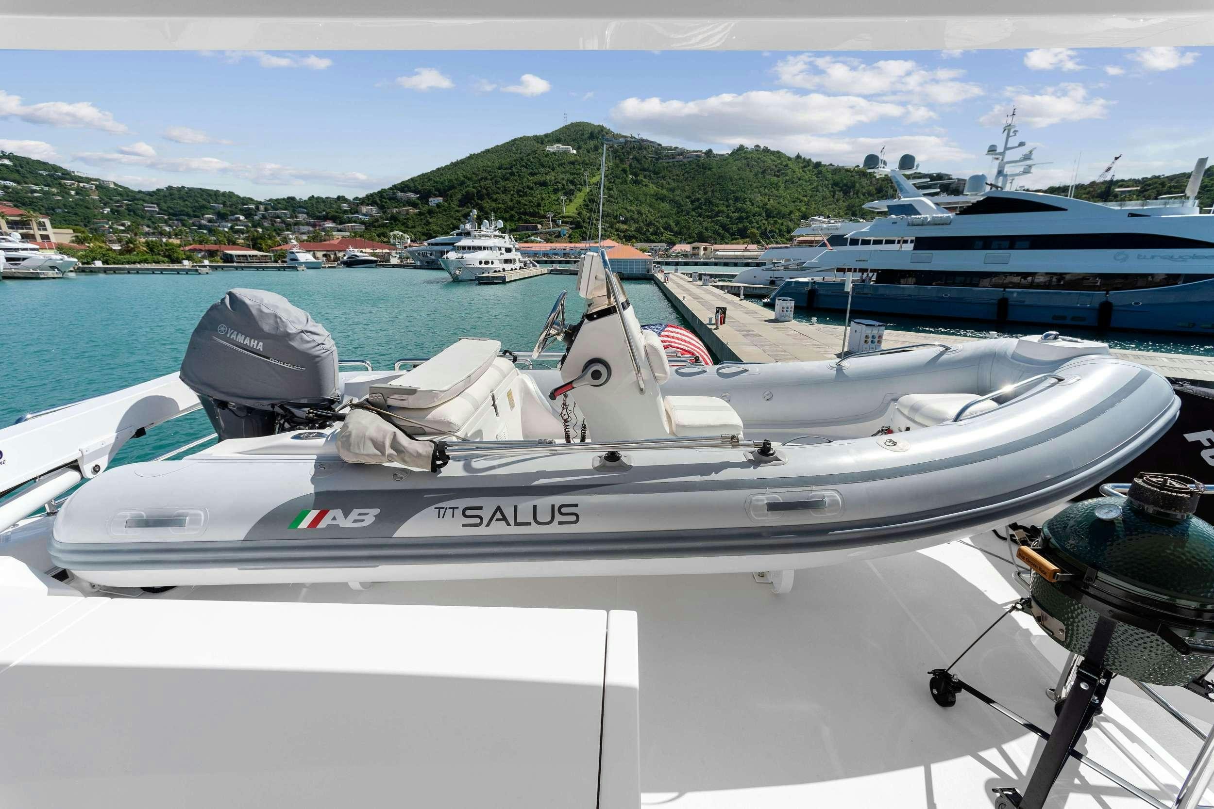 a boat parked on a dock aboard SALUS Yacht for Charter
