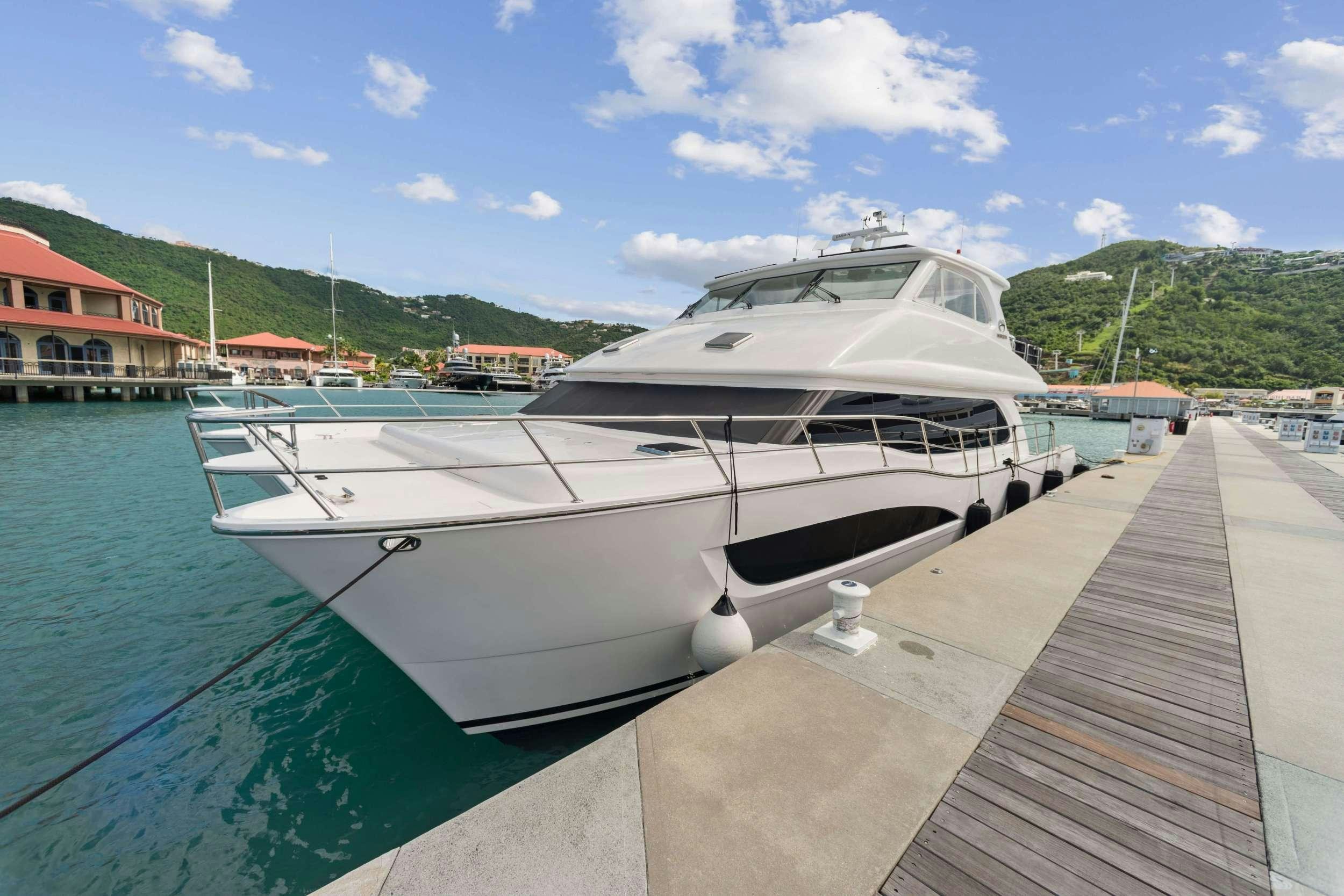 a boat docked at a pier aboard SALUS Yacht for Charter