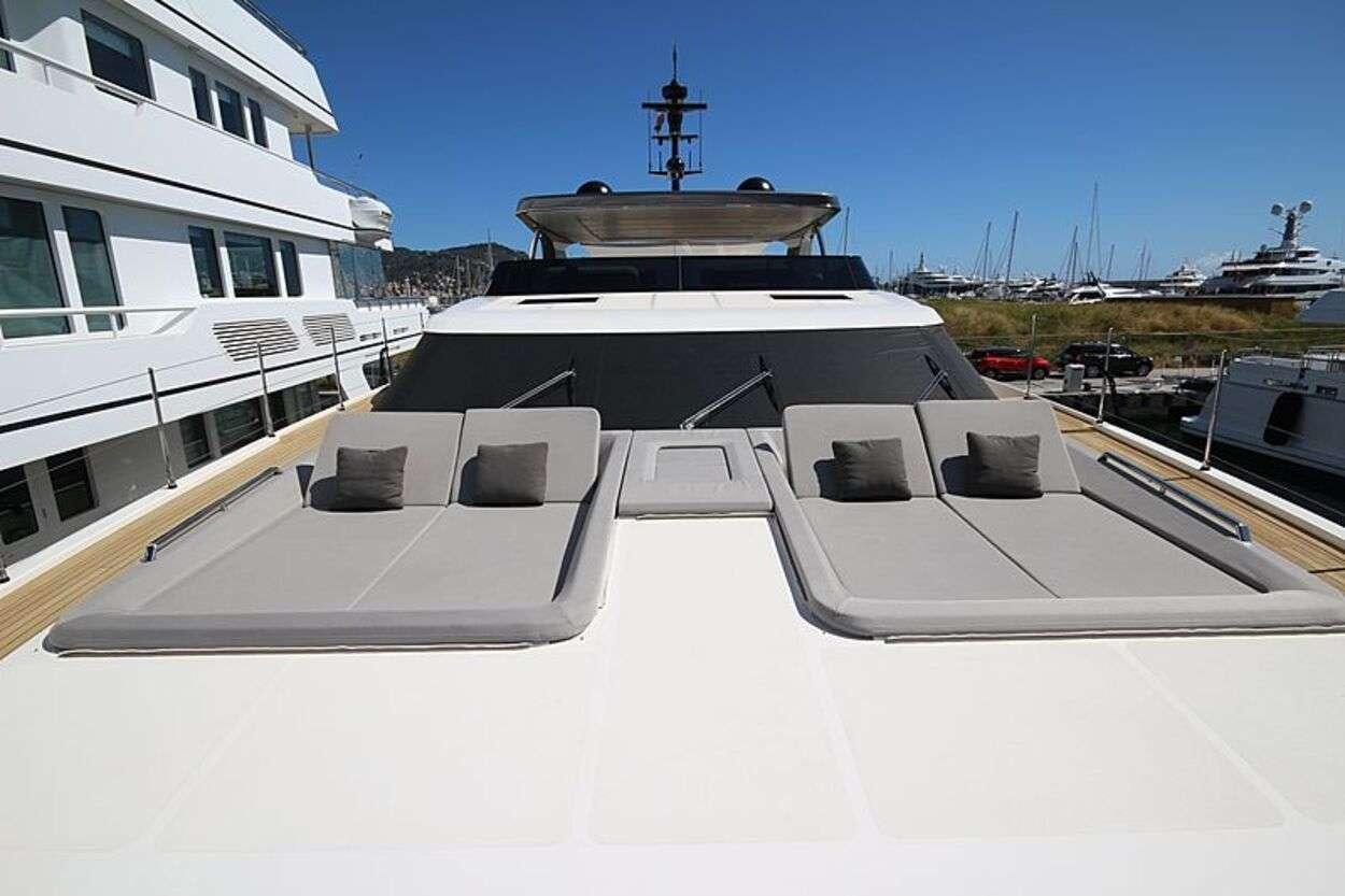 a large ship in a harbor aboard OCTAVE Yacht for Charter