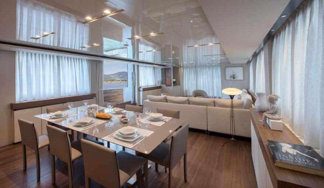 a large room with a table and chairs aboard OCTAVE Yacht for Charter