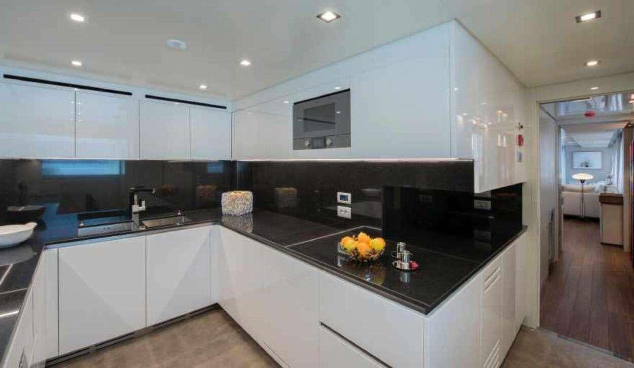 a kitchen with a large island aboard OCTAVE Yacht for Charter