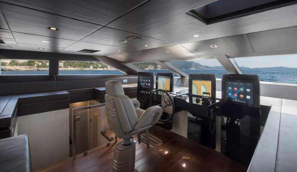 a room with a large window and a view of the ocean aboard OCTAVE Yacht for Charter