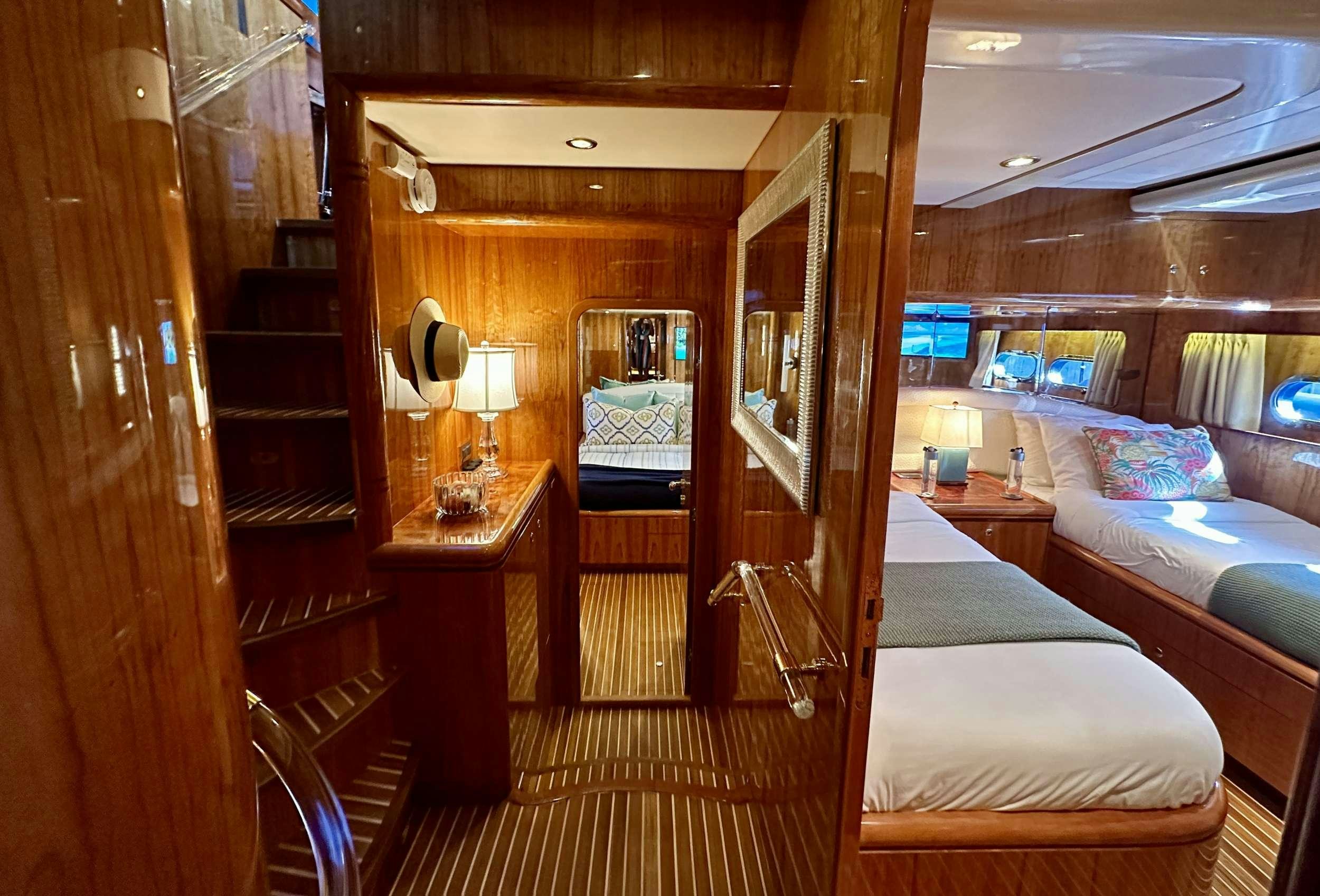 a room with bunk beds aboard QARA Yacht for Charter
