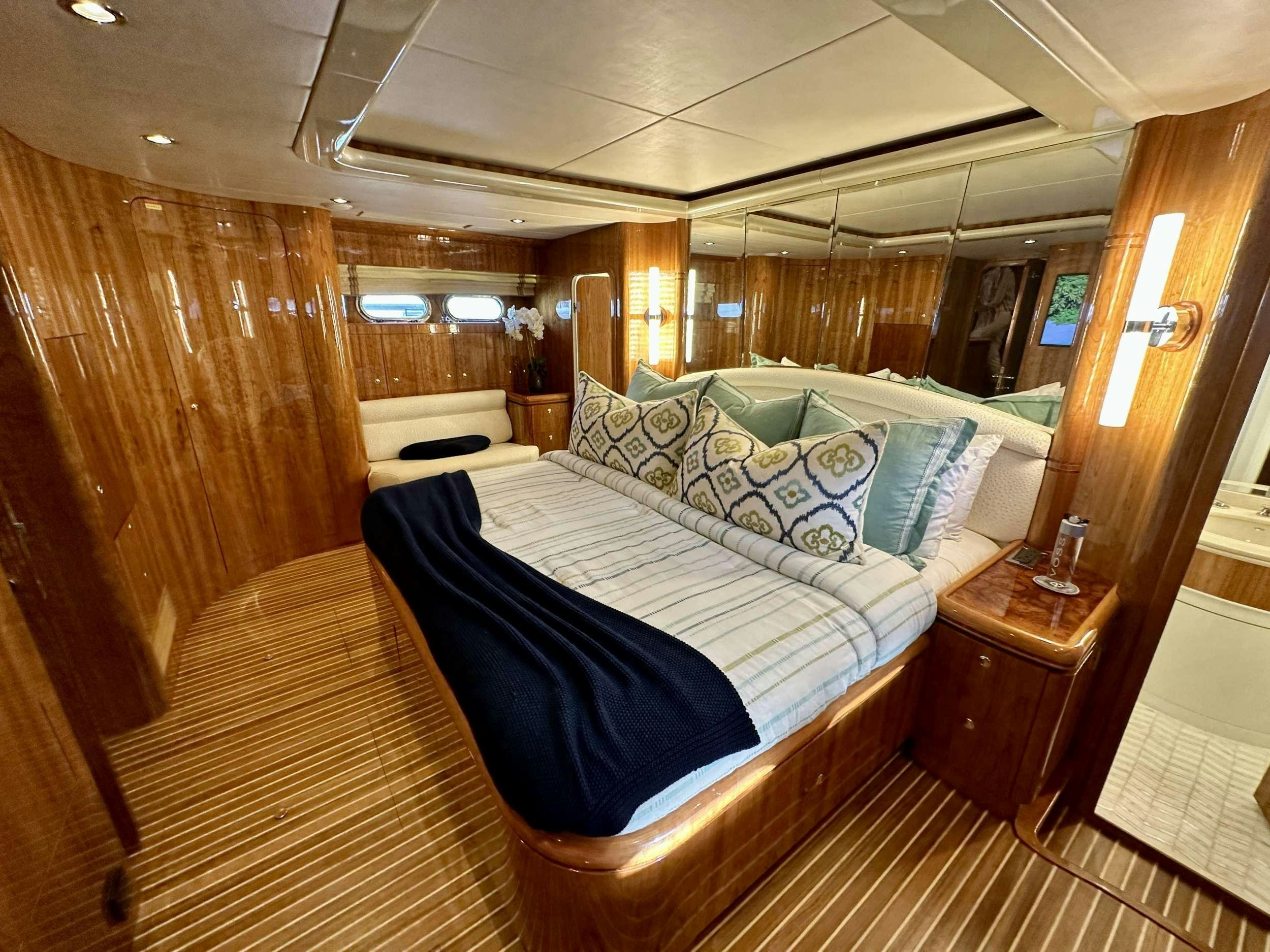 a bed in a room aboard QARA Yacht for Charter