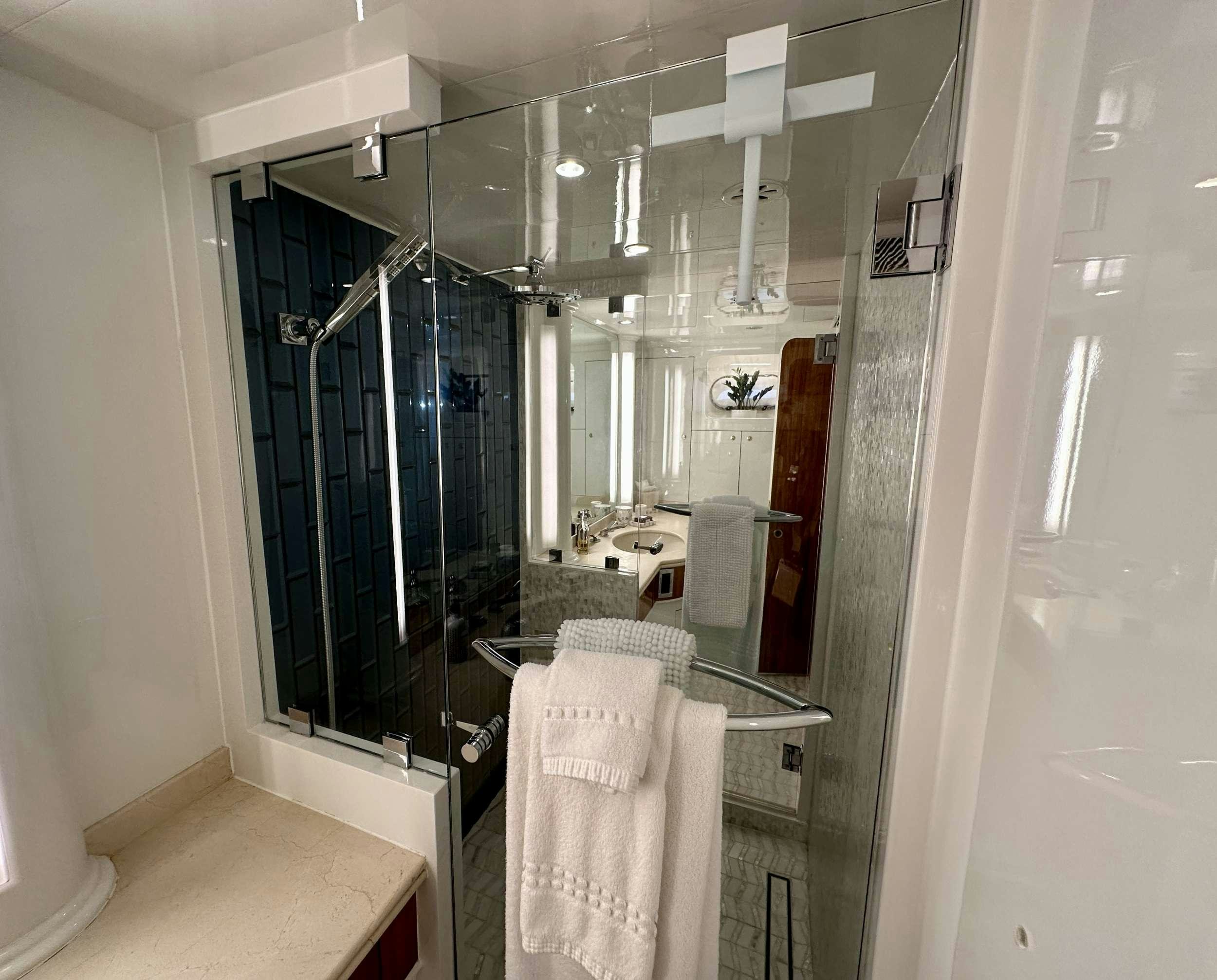 a bathroom with a shower aboard QARA Yacht for Charter