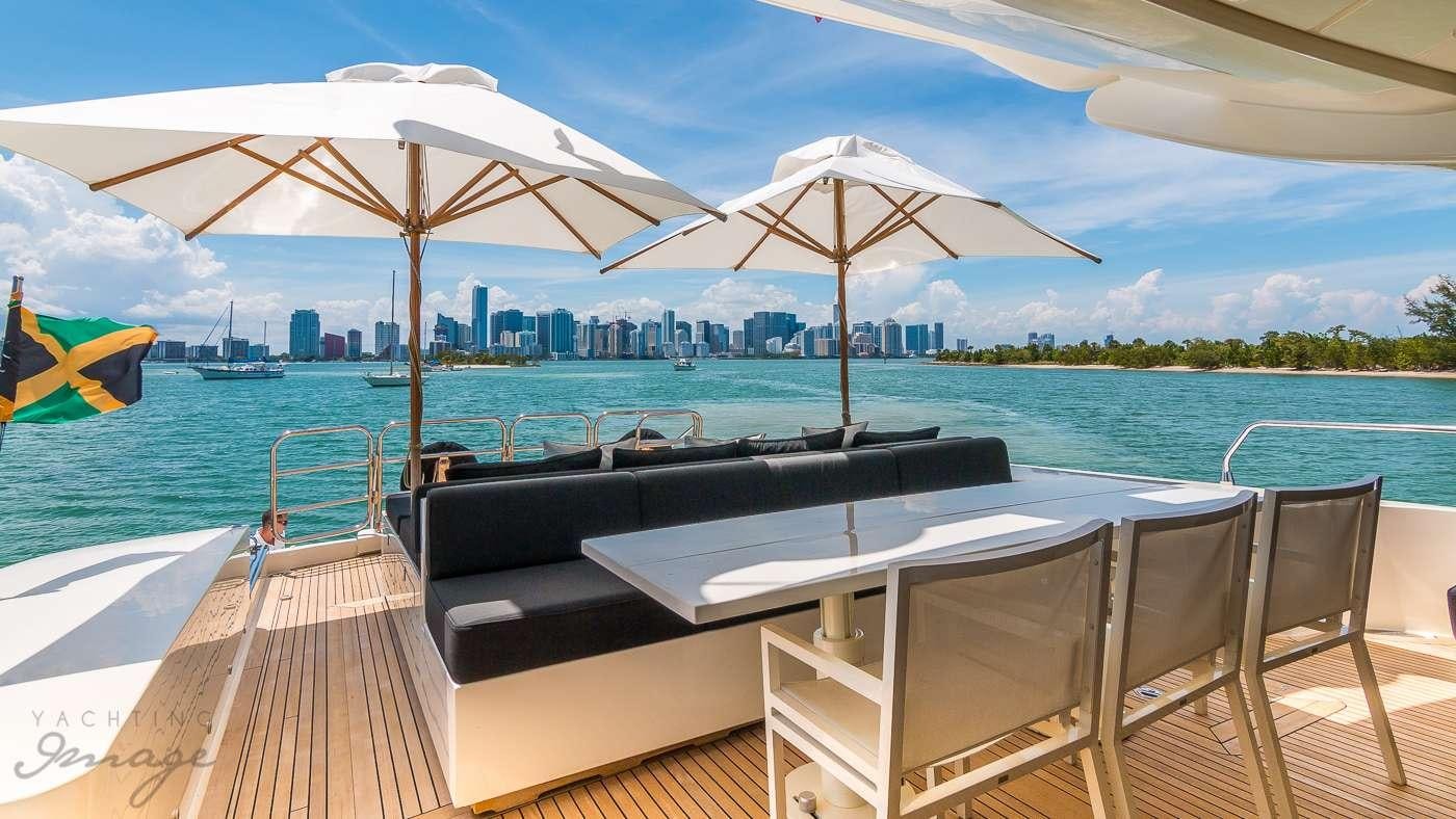 a table and chairs on a deck aboard VENTURE Yacht for Charter