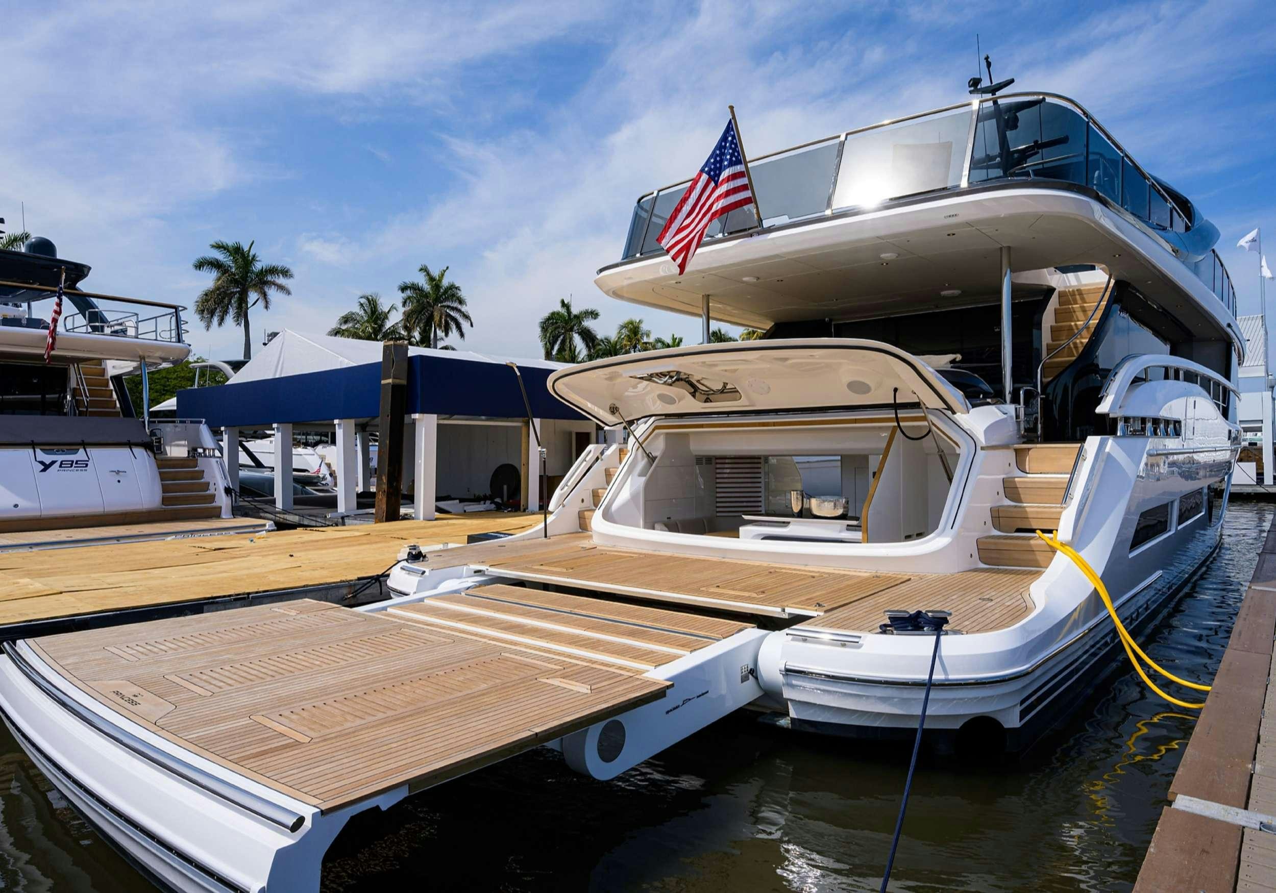 a boat docked at a pier aboard MONOPOLY Yacht for Charter