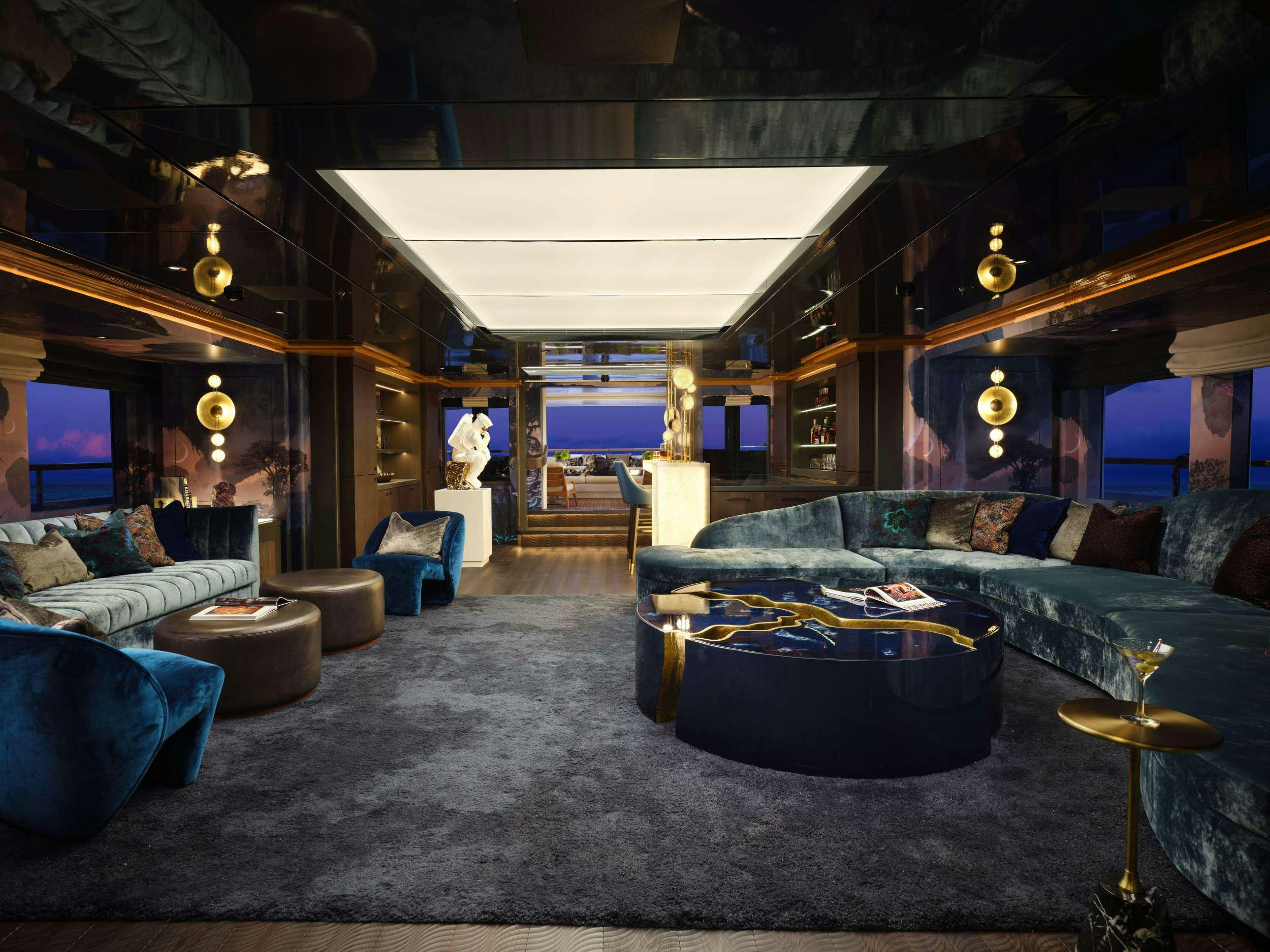 a room with couches and a television aboard GALAXY Yacht for Charter