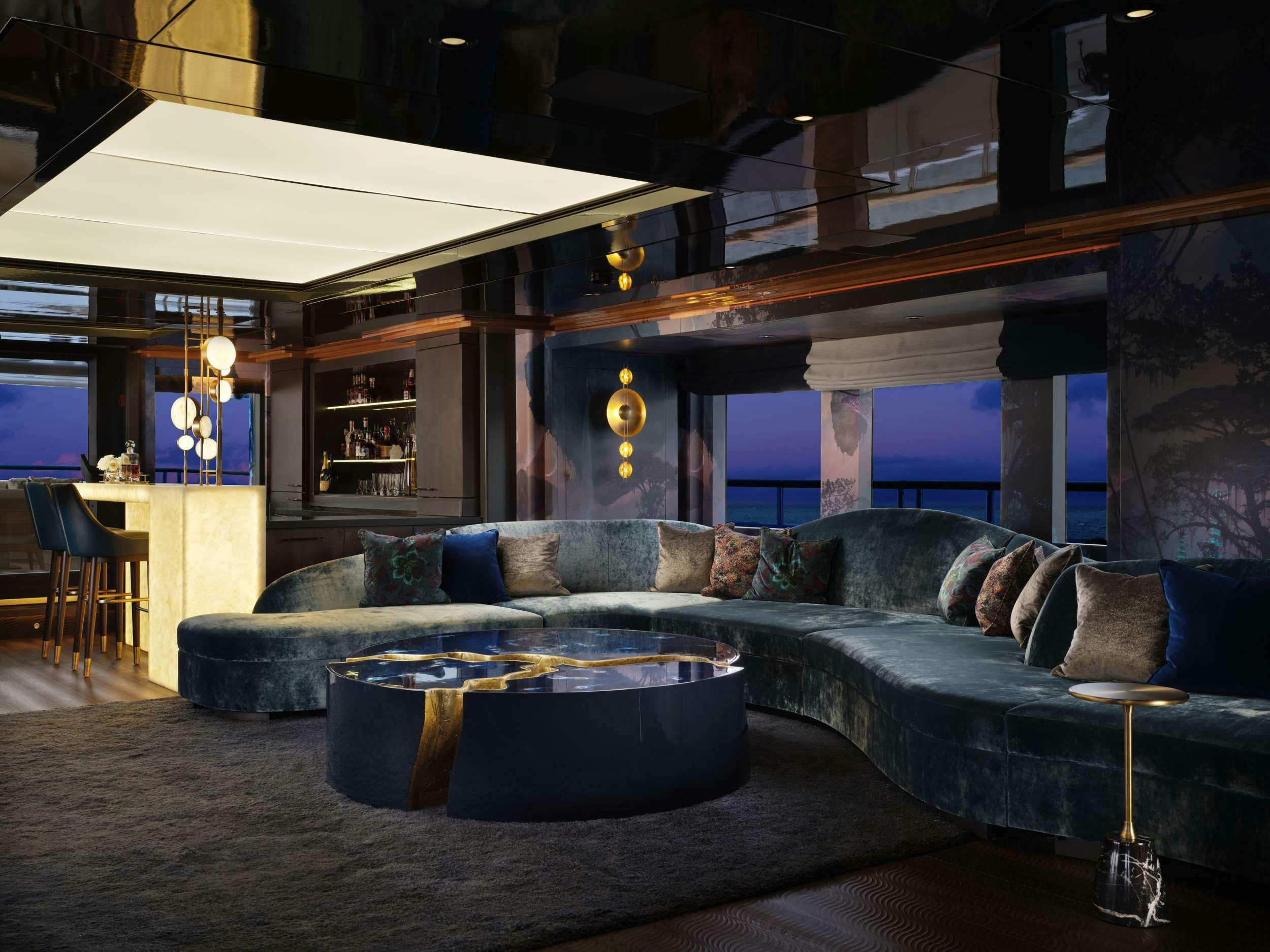 a living room with a couch and a table aboard GALAXY Yacht for Charter